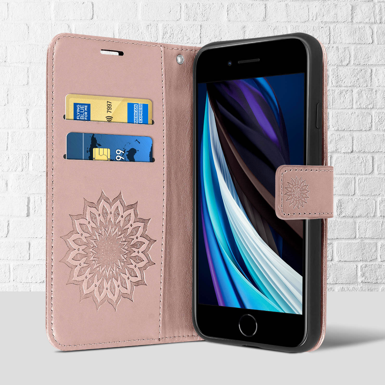 Una custodia per telefono rosa con un design a mandala, fessure per carte di credito e un telefono all'interno.