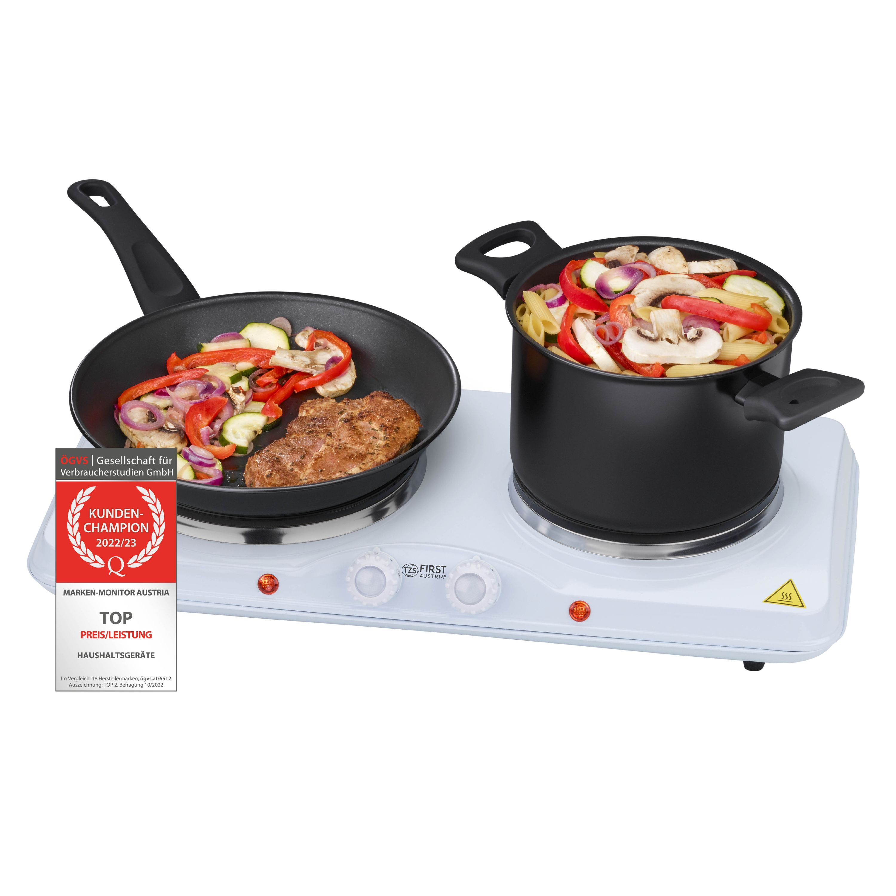 Ein Doppelkochfeld mit einer Bratpfanne mit Essen und einem Topf mit Essen darauf.