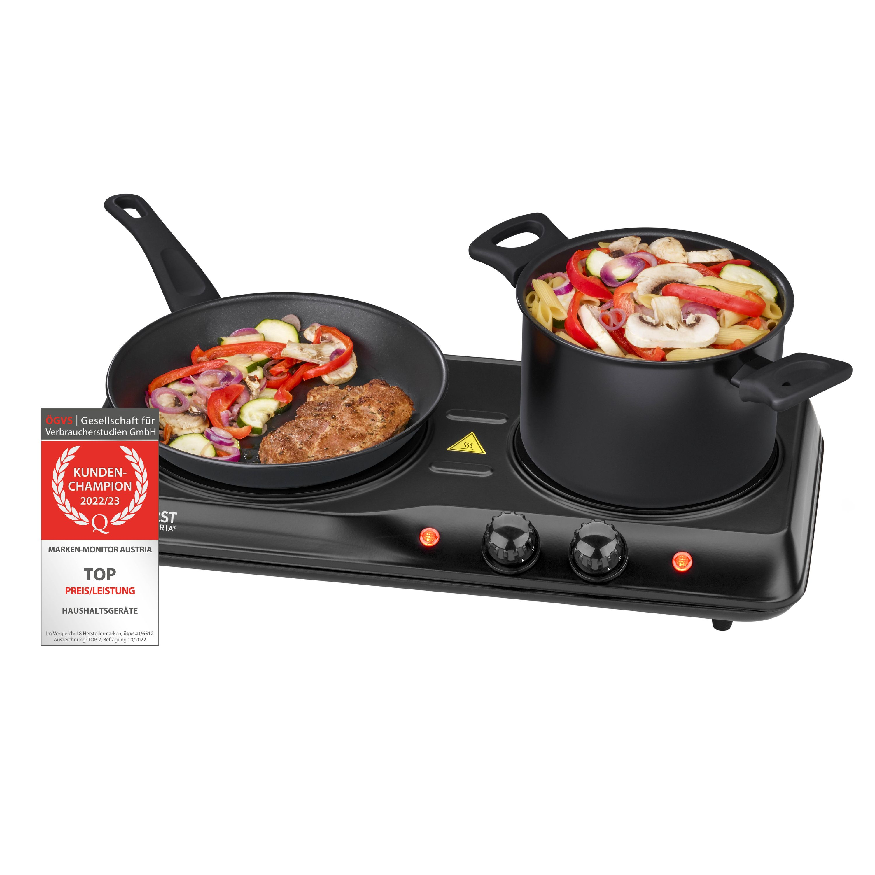 Eine Kochplatte mit einer Pfanne mit Essen und einem Topf.