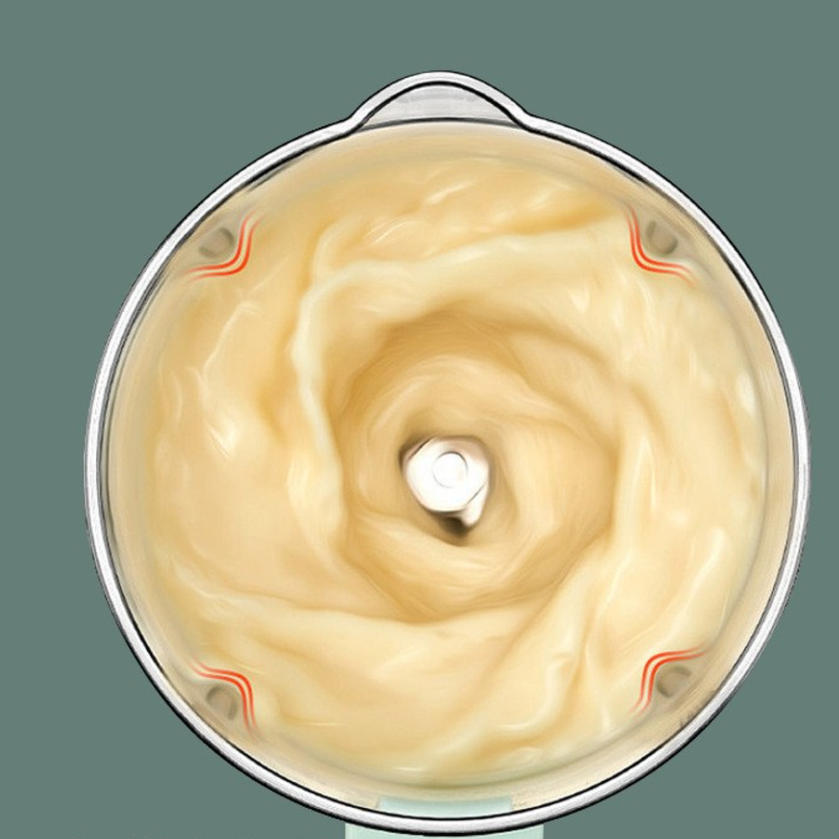 Ein Mixer, der eine hellfarbige Flüssigkeit mischt, mit roten Akzenten auf der Schüssel.