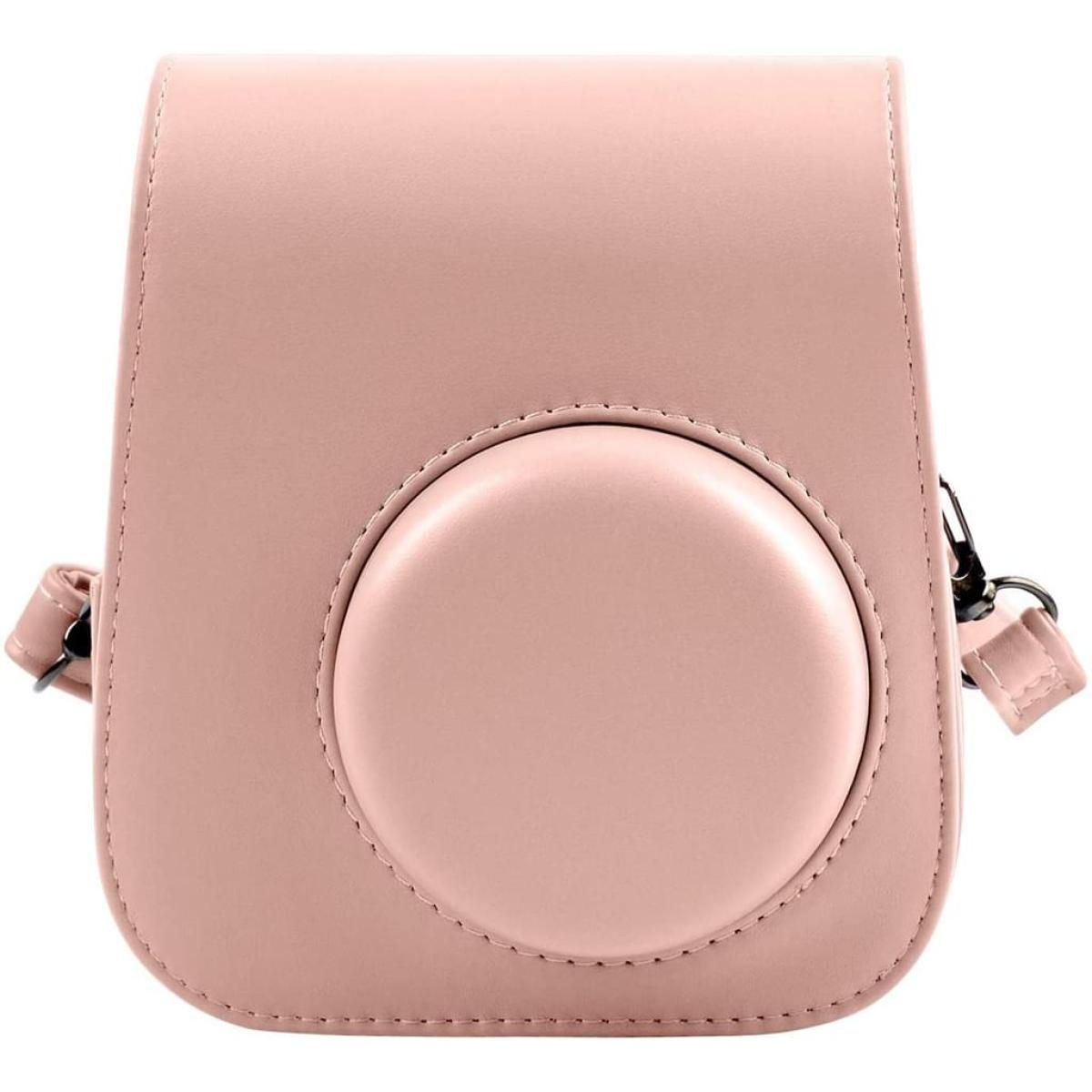 Rosa Kameratasche mit runder Form und kreisförmigem Design vorne, mit Riemen.
