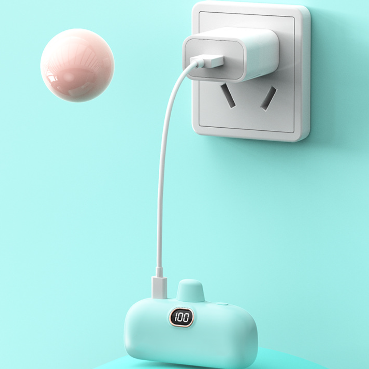 Ein hellblaues Handgerät, das mit einem weißen Ladekabel an eine Steckdose angeschlossen ist.