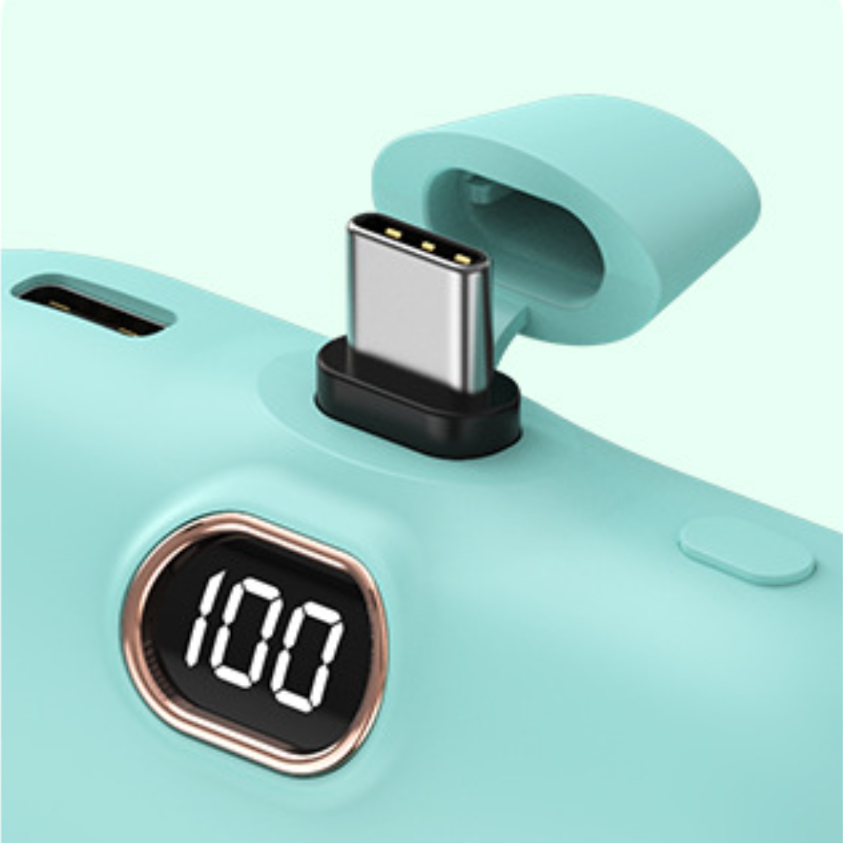 Nahaufnahme eines türkisfarbenen Ladegeräts mit USB-C-Anschluss. Eine Digitalanzeige zeigt 100.