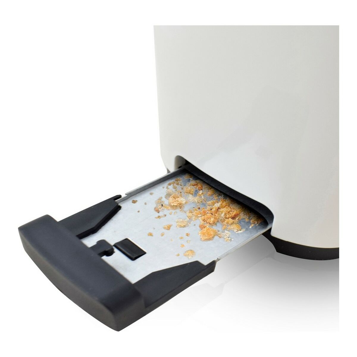 Ein Toaster mit herausgezogener Krümelschublade, die Brotkrümel zeigt.