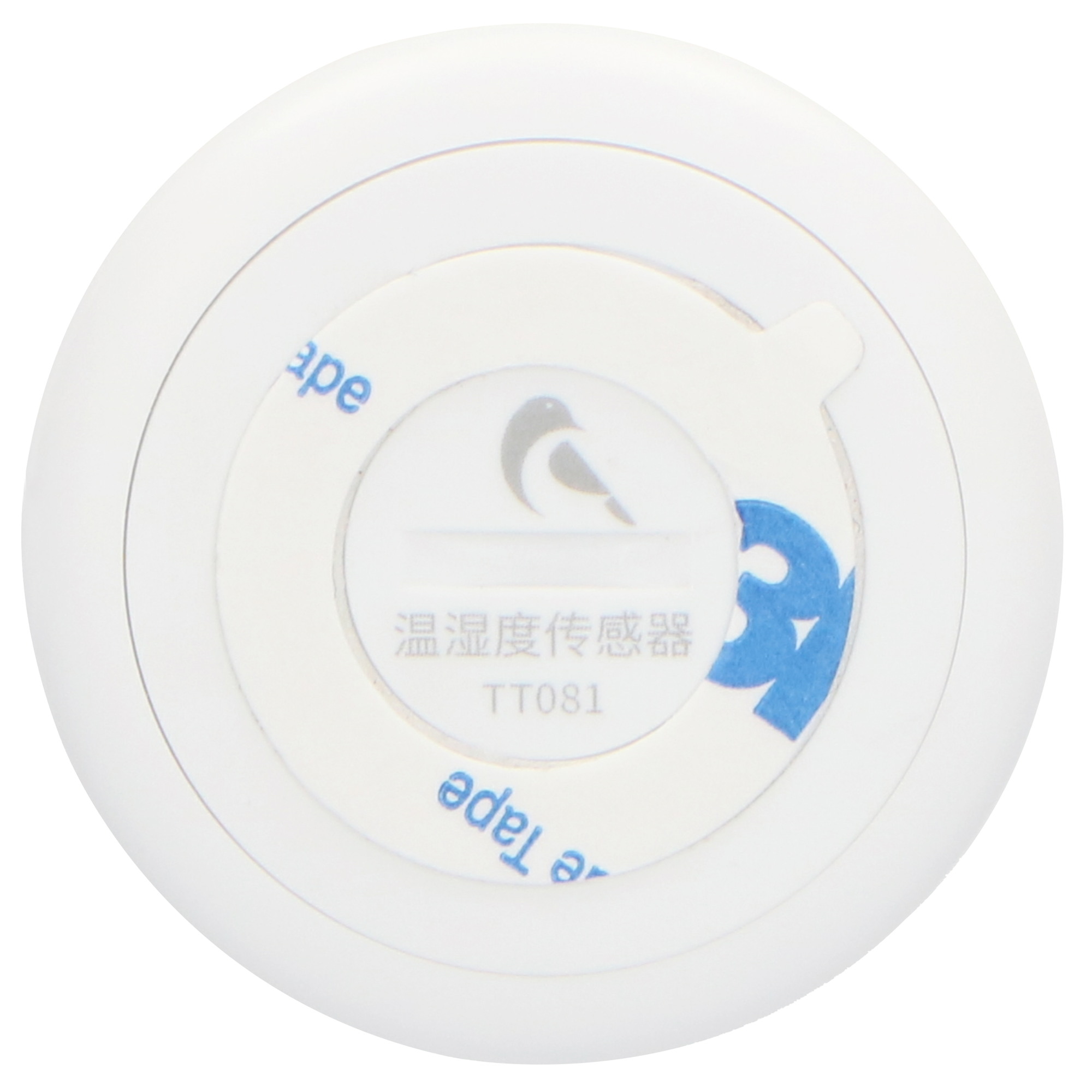 A white round device with a sticker, on a white surface.