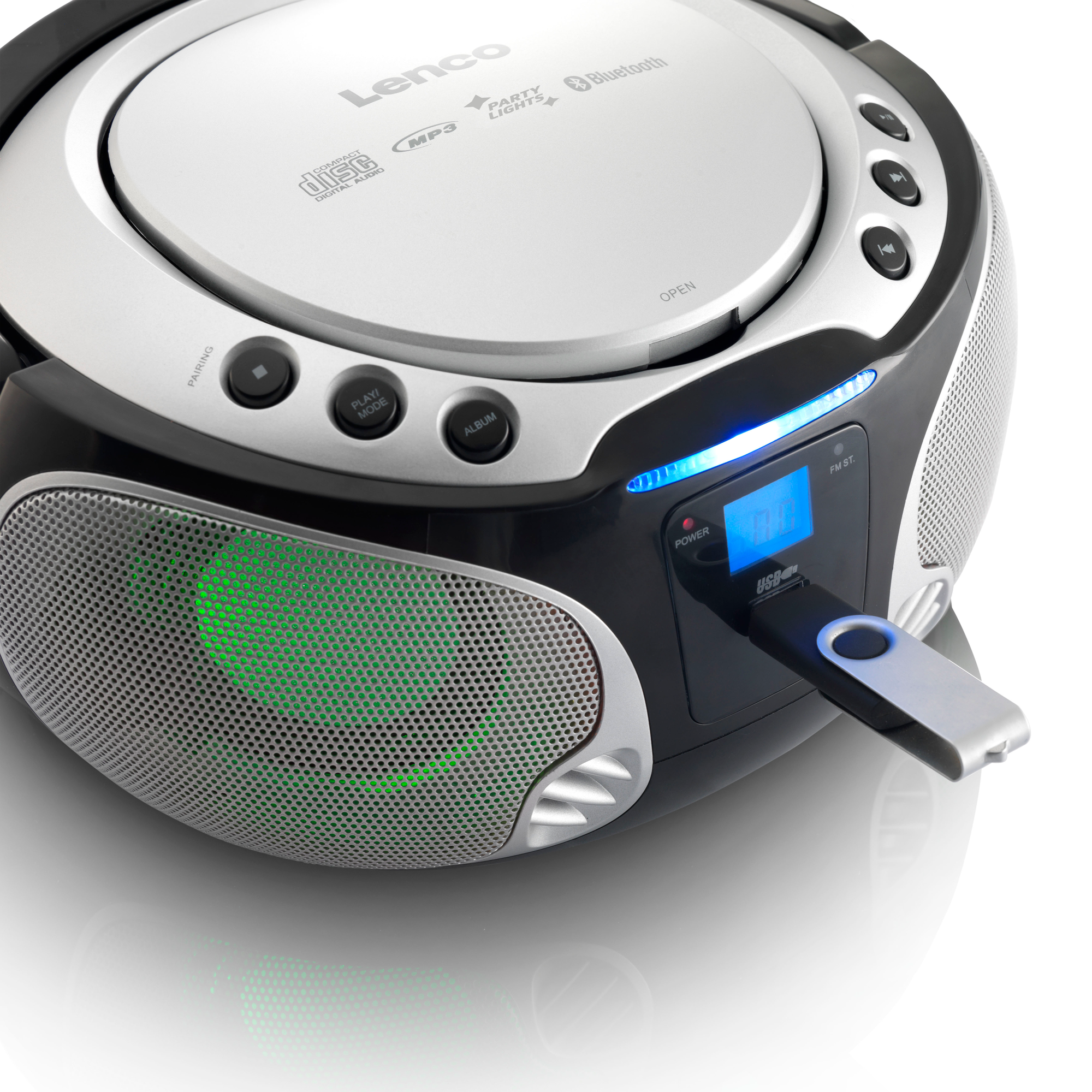 Black and silver Lenco CD player with a USB drive inserted. The speaker has a green light.
