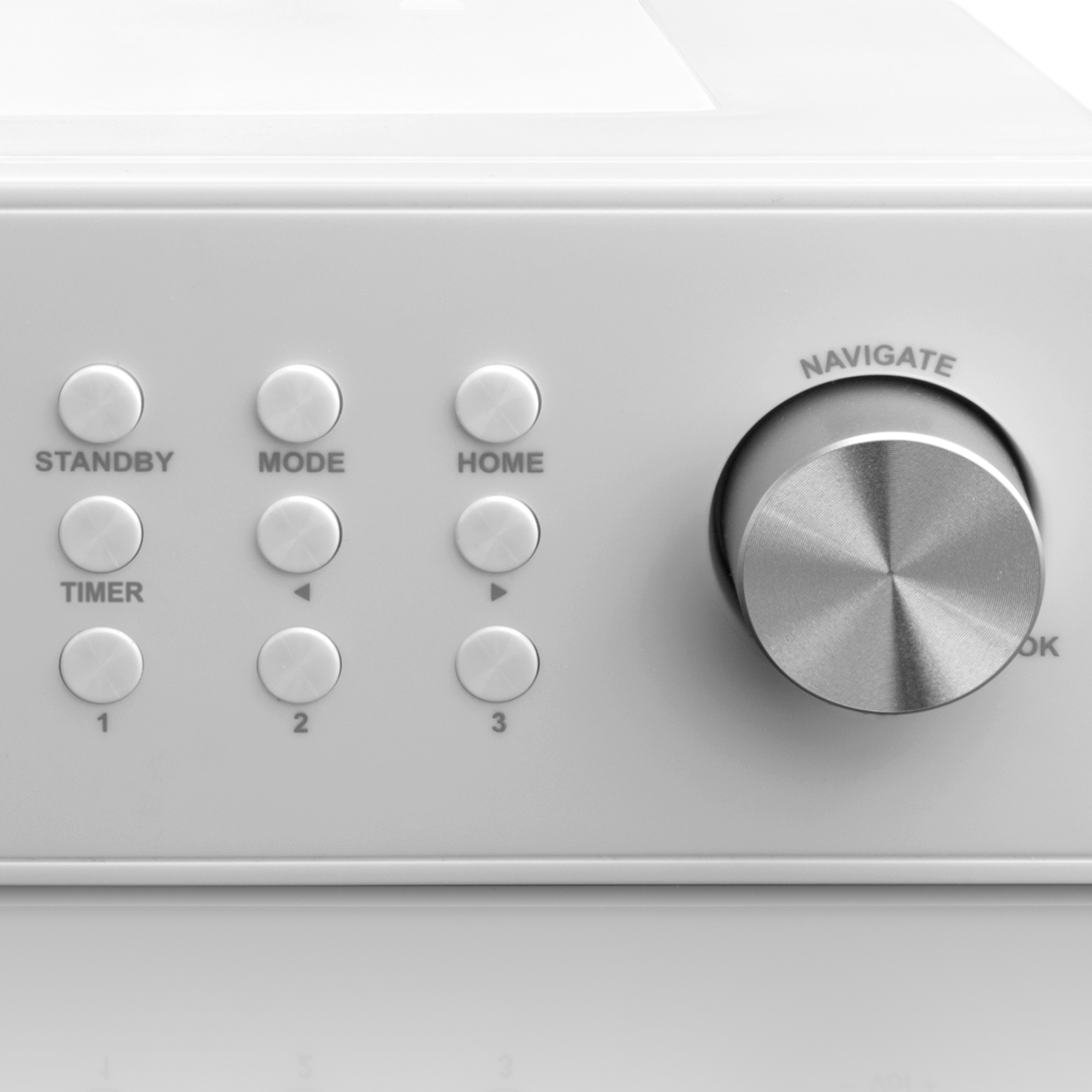 White device with buttons labeled 'STANDBY', 'MODE', 'HOME', and a knob labeled 'NAVIGATE'.