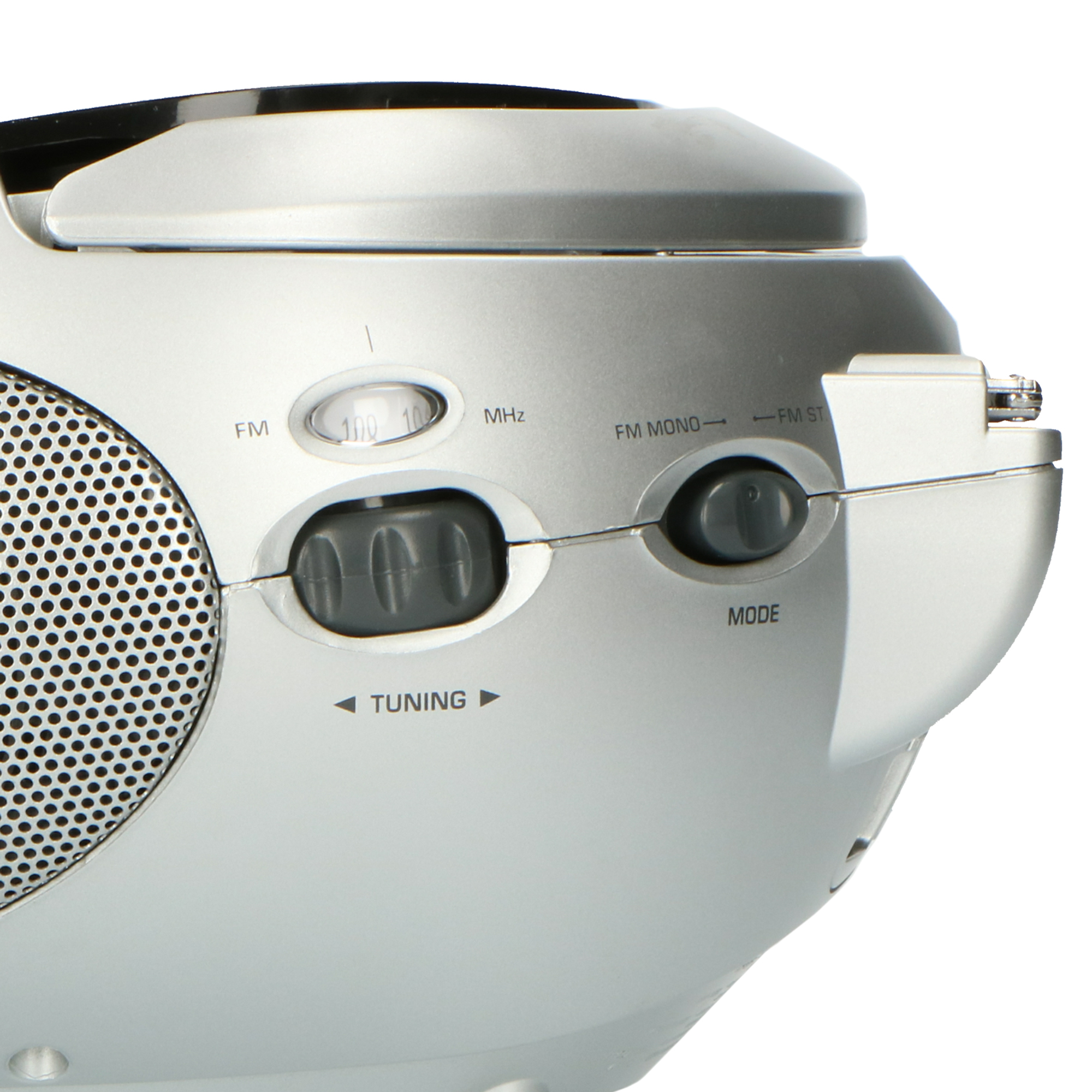 Silver radio with buttons for tuning, mode, and frequency. The speaker is visible.
