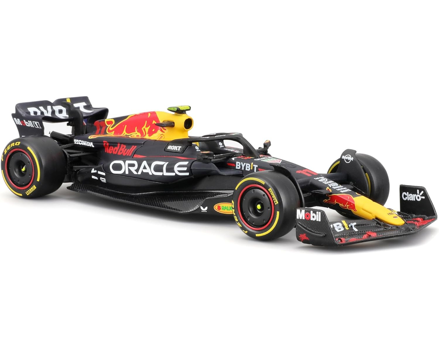 Samochód Formuły 1 Red Bull. Jest czarny z czerwonymi i żółtymi akcentami. Loga Oracle i Honda są widoczne.