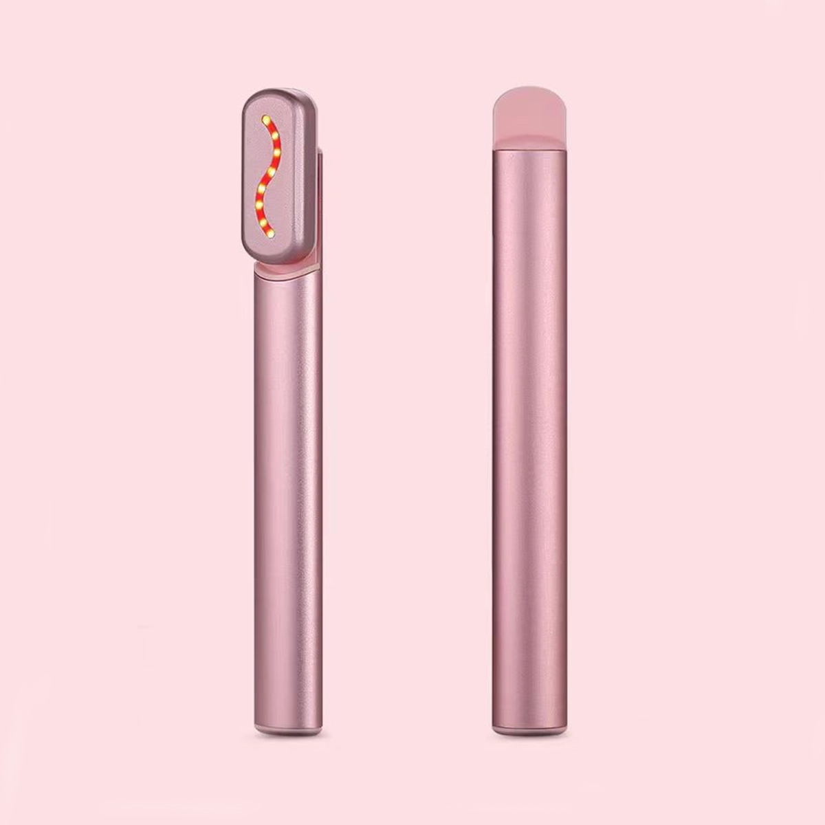 Zwei rosa Schönheitsgeräte vor rosa Hintergrund.