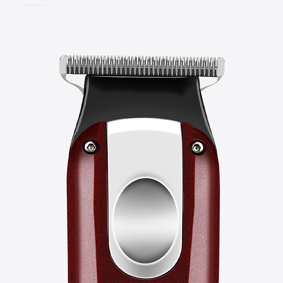Nahaufnahme eines rot-schwarzen Haarschneiders. Metallklinge sichtbar. Weißer Hintergrund.