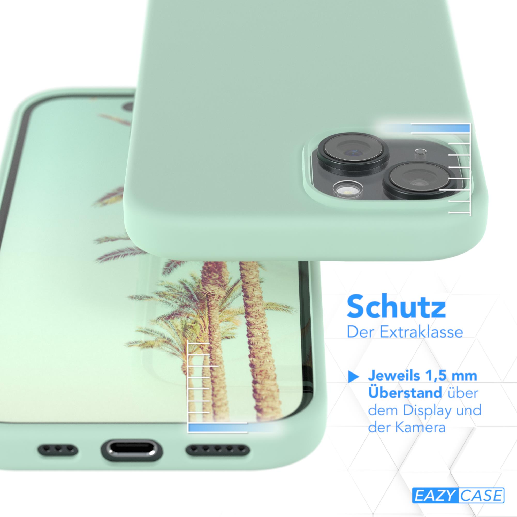 Ein Telefon in einer mintgrünen Hülle, Nahaufnahme mit Palmenhintergrund.