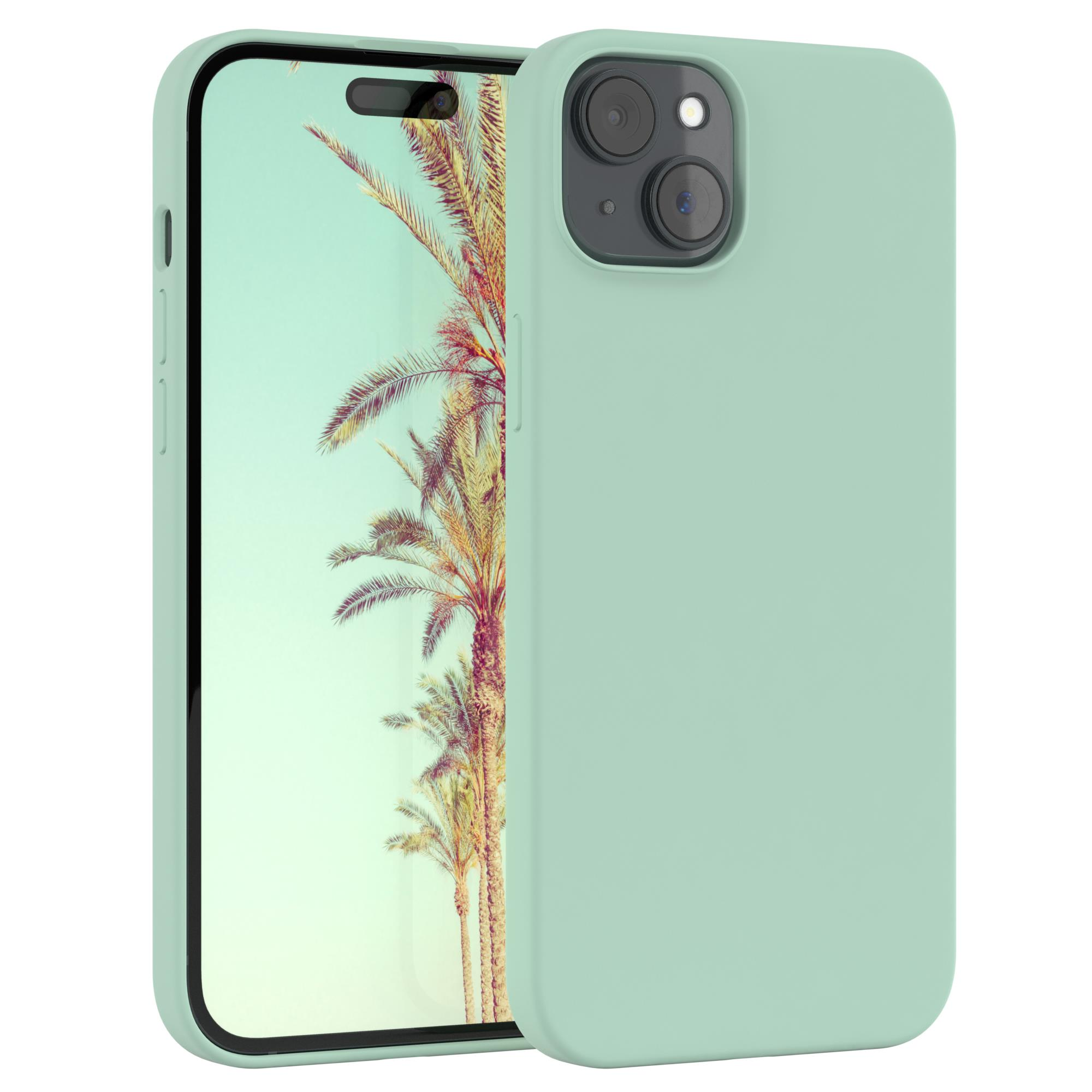 Ein mintfarbenes Telefon mit mintfarbener Hülle wird gezeigt und zeigt ein Strandbild auf dem Bildschirm.
