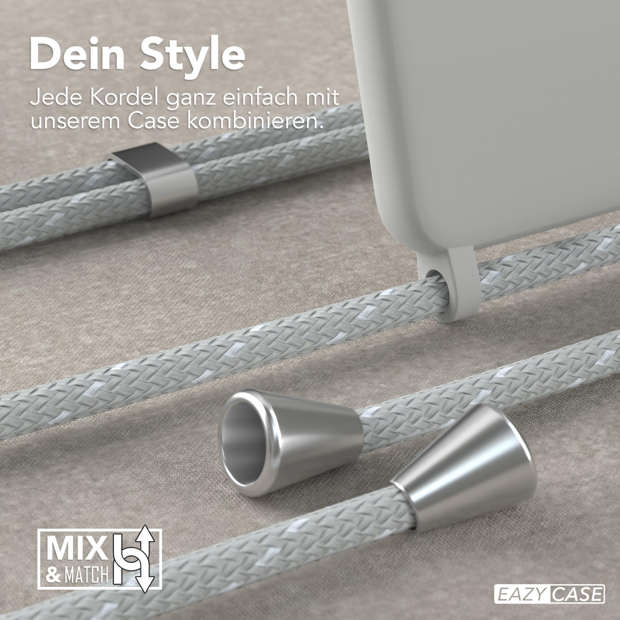 Nahaufnahme von Telefonkabel mit Metallanschlüssen, grauem Kabel und weißer Handyhülle.