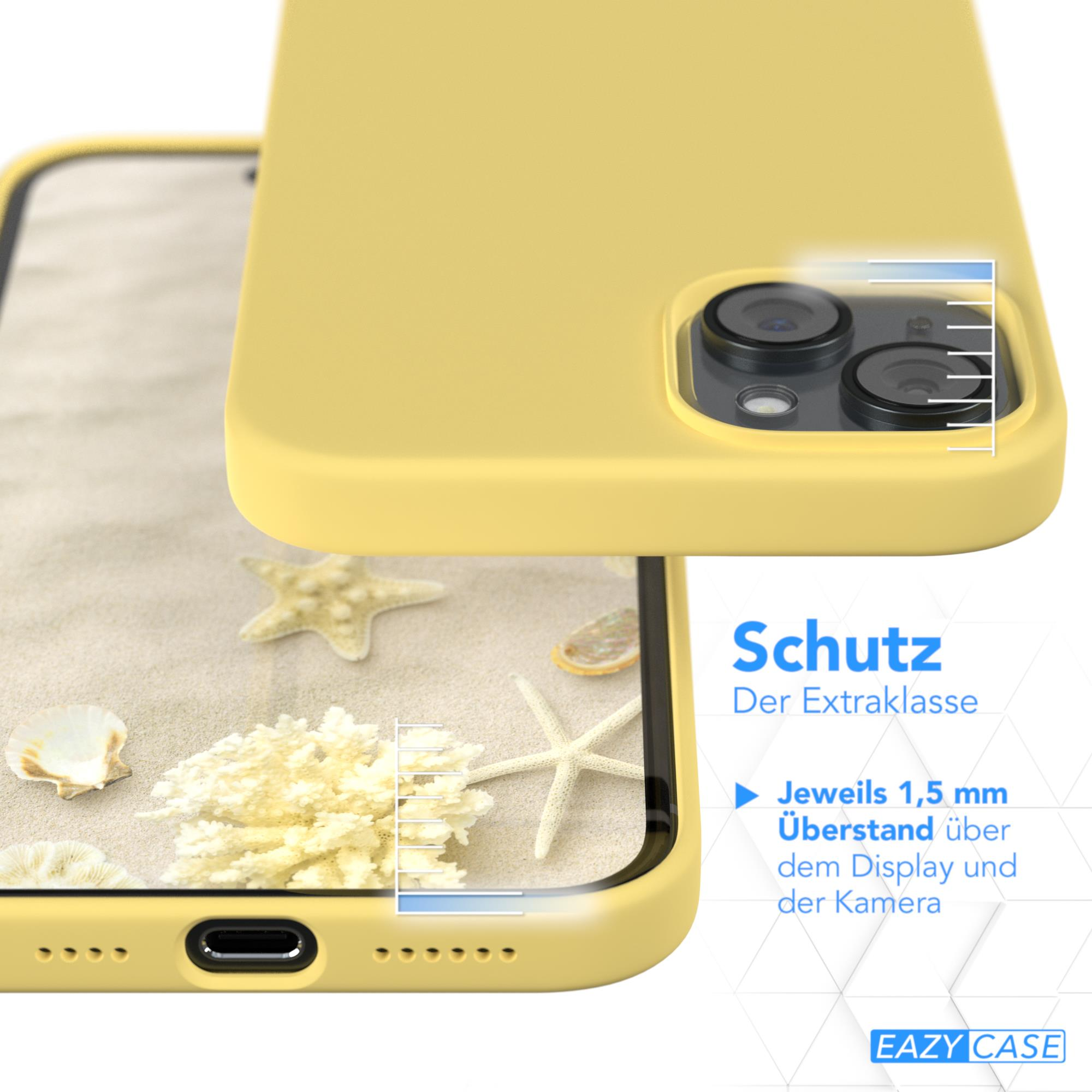 Gelbe Handyhülle über sandartigem Hintergrund mit Muscheln und Seesternen.