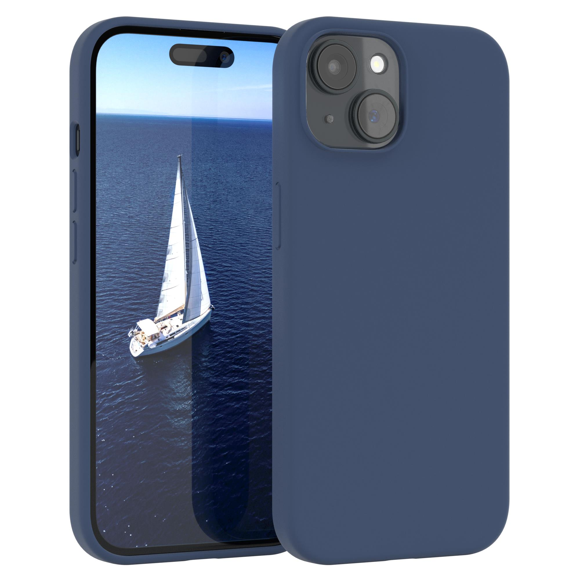 Eine blaue Handyhülle mit einem Telefon darin. Das Telefon zeigt ein Segelboot auf dem Ozean.