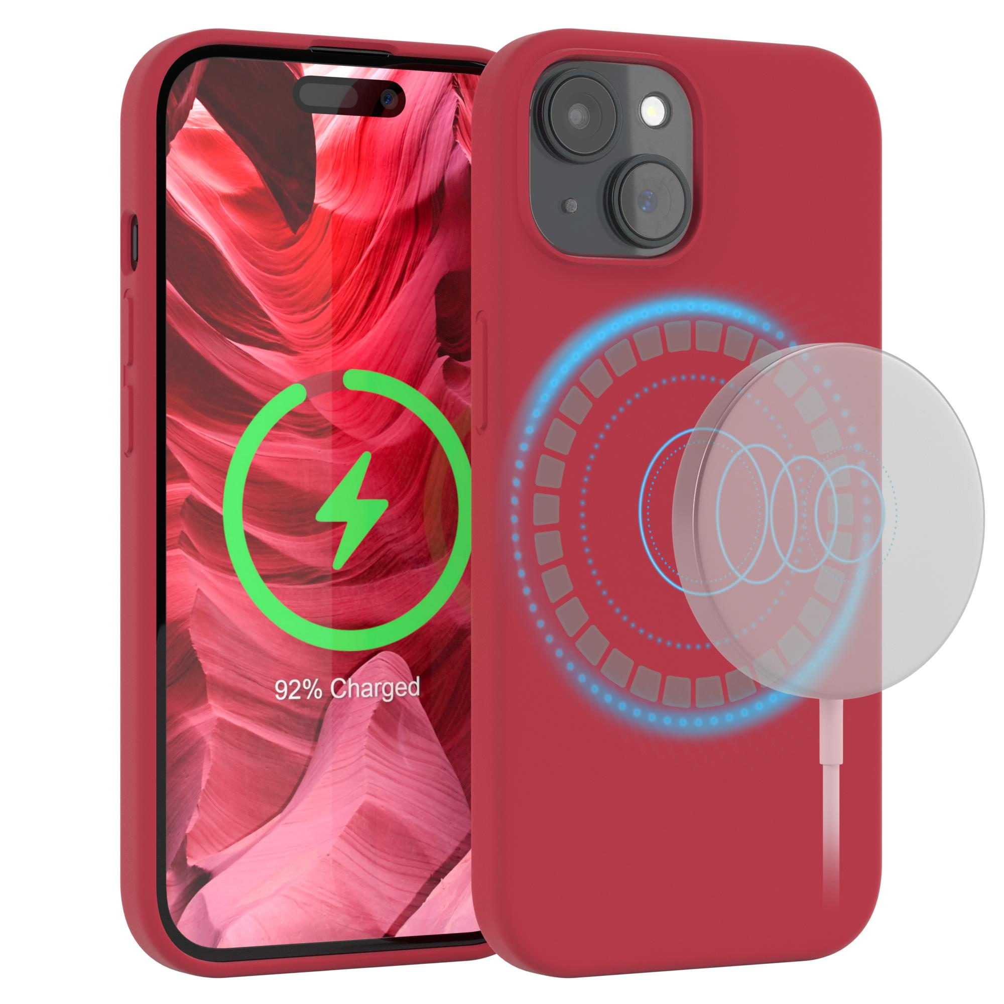 Ein rotes iPhone mit Ladebildschirm und Ladekreis, neben einem MagSafe-Ladegerät.