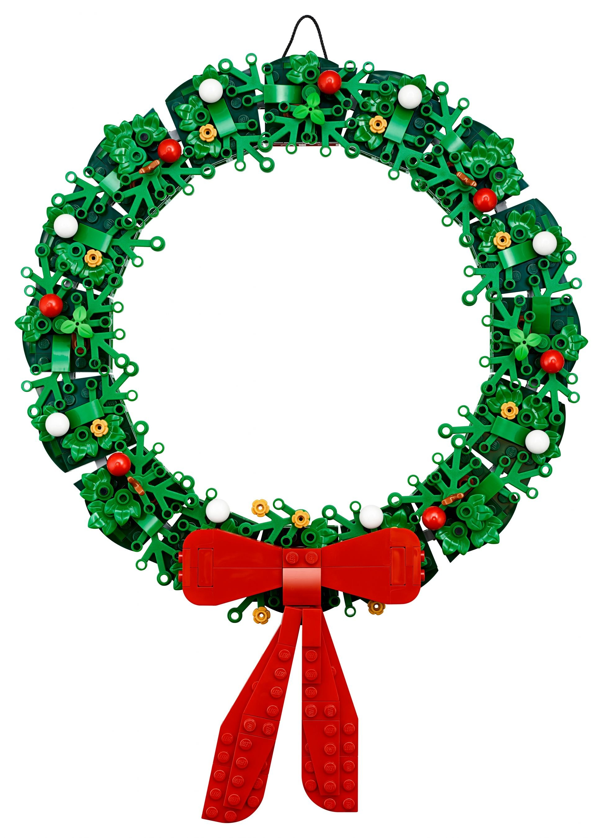LEGO tuğlalarından yapılmış bir Noel çelengi, kırmızı kurdele, beyaz ve kırmızı vurgularla.