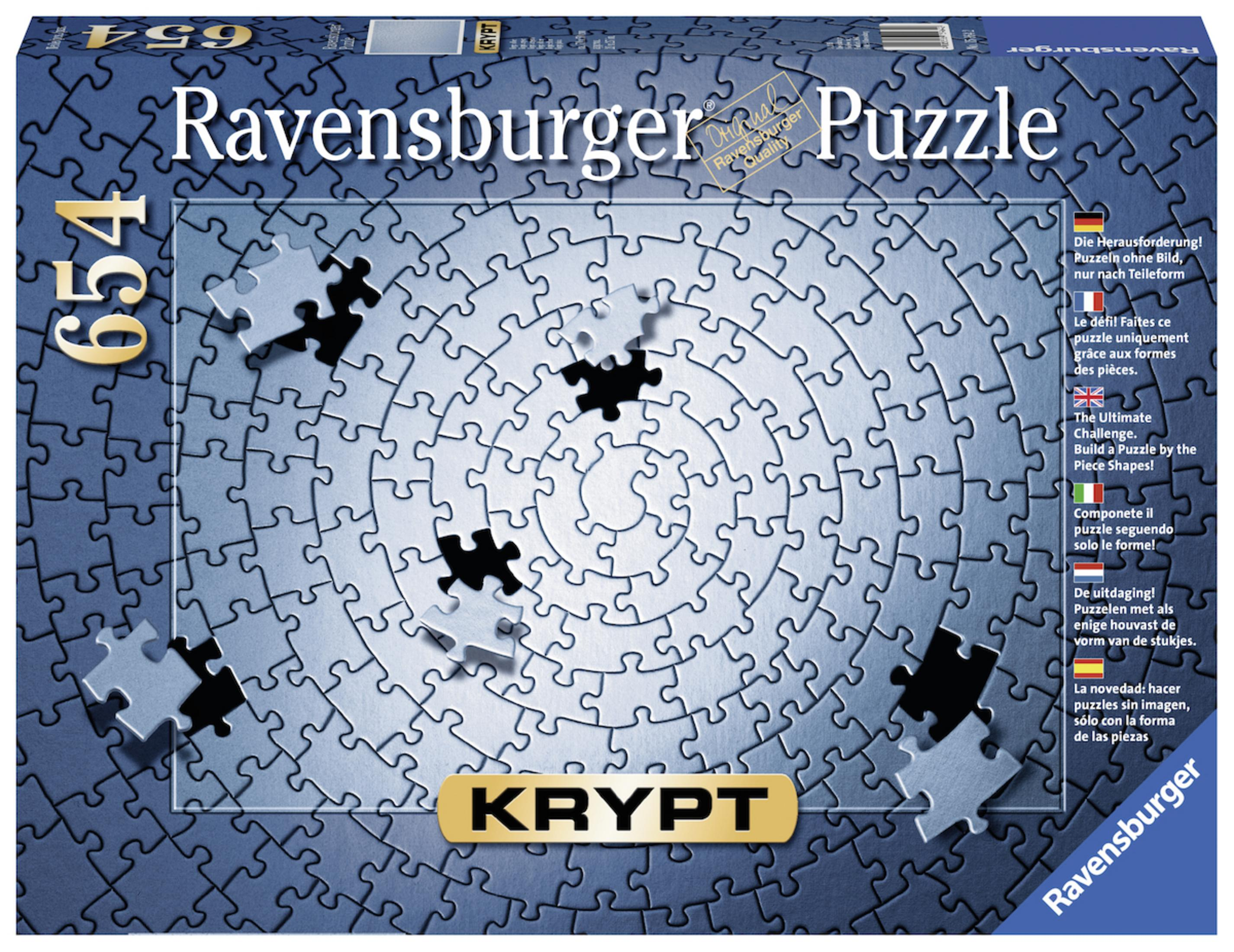 Pudełko z puzzlami z rozrzuconymi elementami. Na pudełku napis "Ravensburger Puzzle".