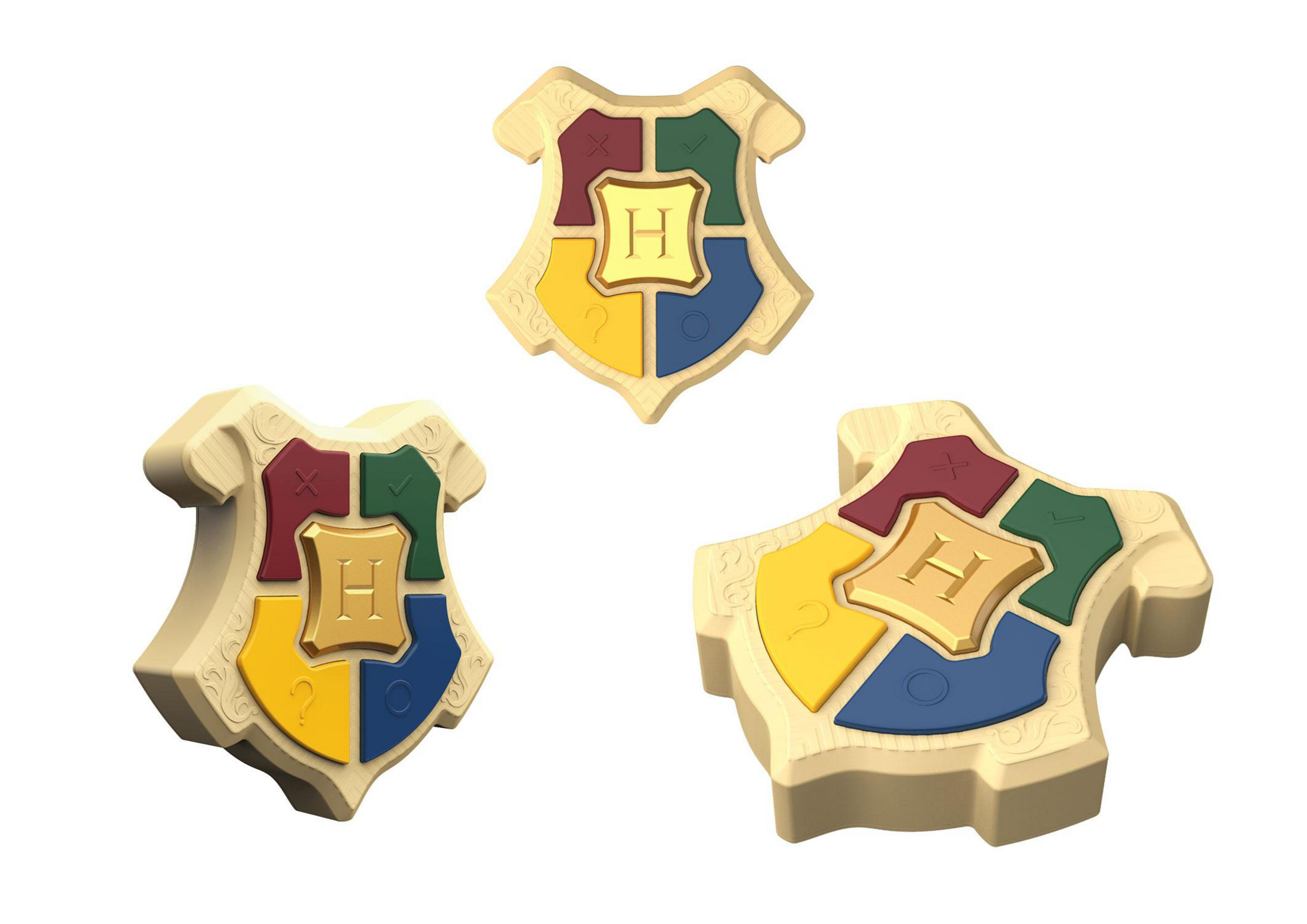 Drei Harry Potter Puzzleteile in Form des Hogwarts-Wappens.