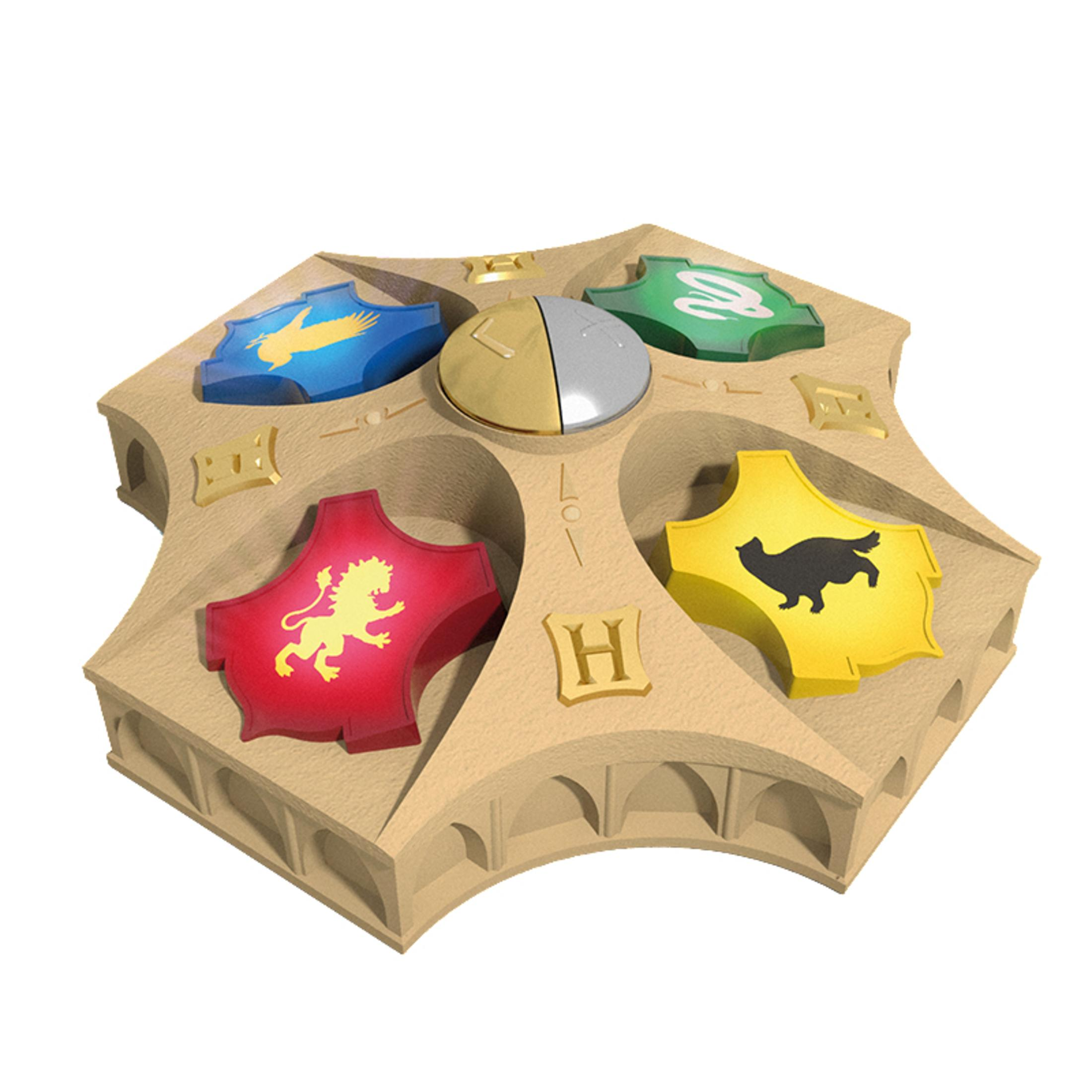 Ein Spiel, ein dekoratives Stück mit vier Emblemen. Es hat Harry Potter-Thema und ist auf einem Tisch.