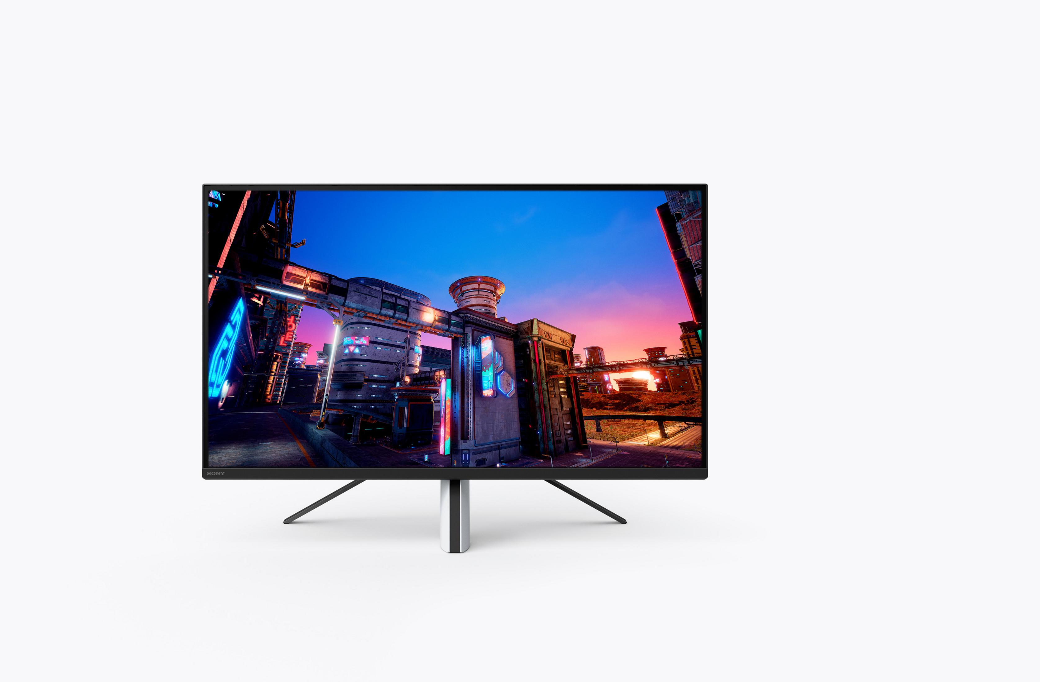 Ein Computermonitor, der eine futuristische Stadtlandschaft mit blauem und orangefarbenem Himmel zeigt.