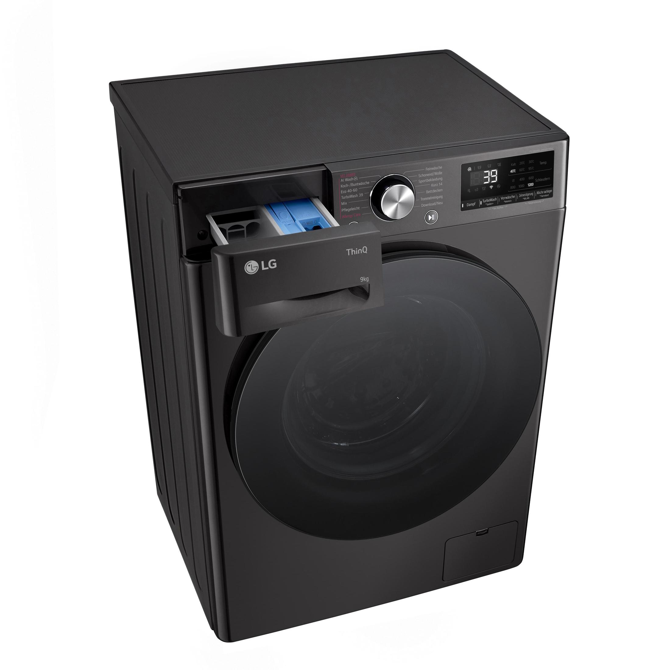 Schwarze LG Waschmaschine. Waschmittelschublade ist offen. Tür ist geschlossen. Draufsicht.