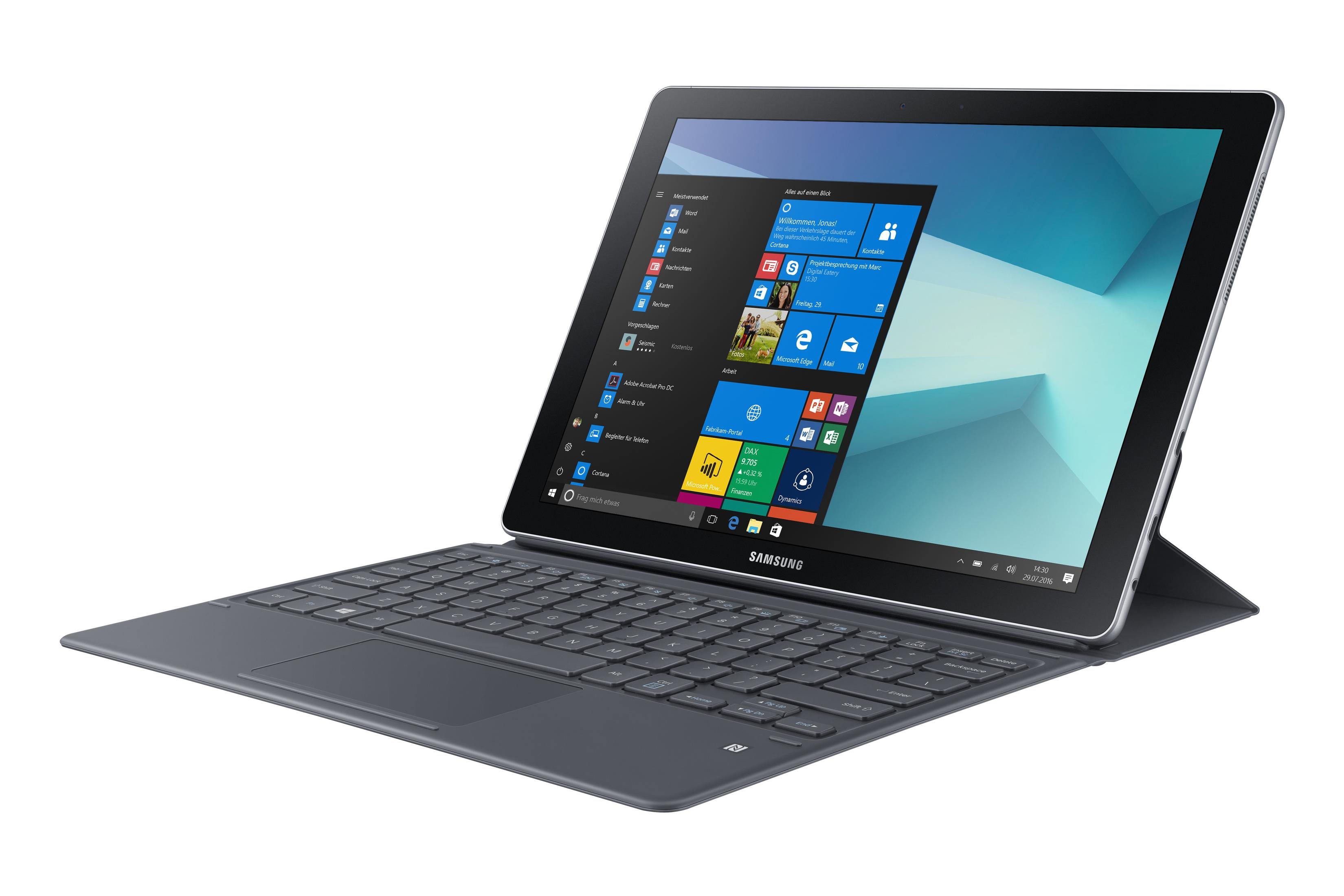 Tablet mit angeschlossener Tastatur, zeigt einen Windows-Desktop mit vielen Symbolen.