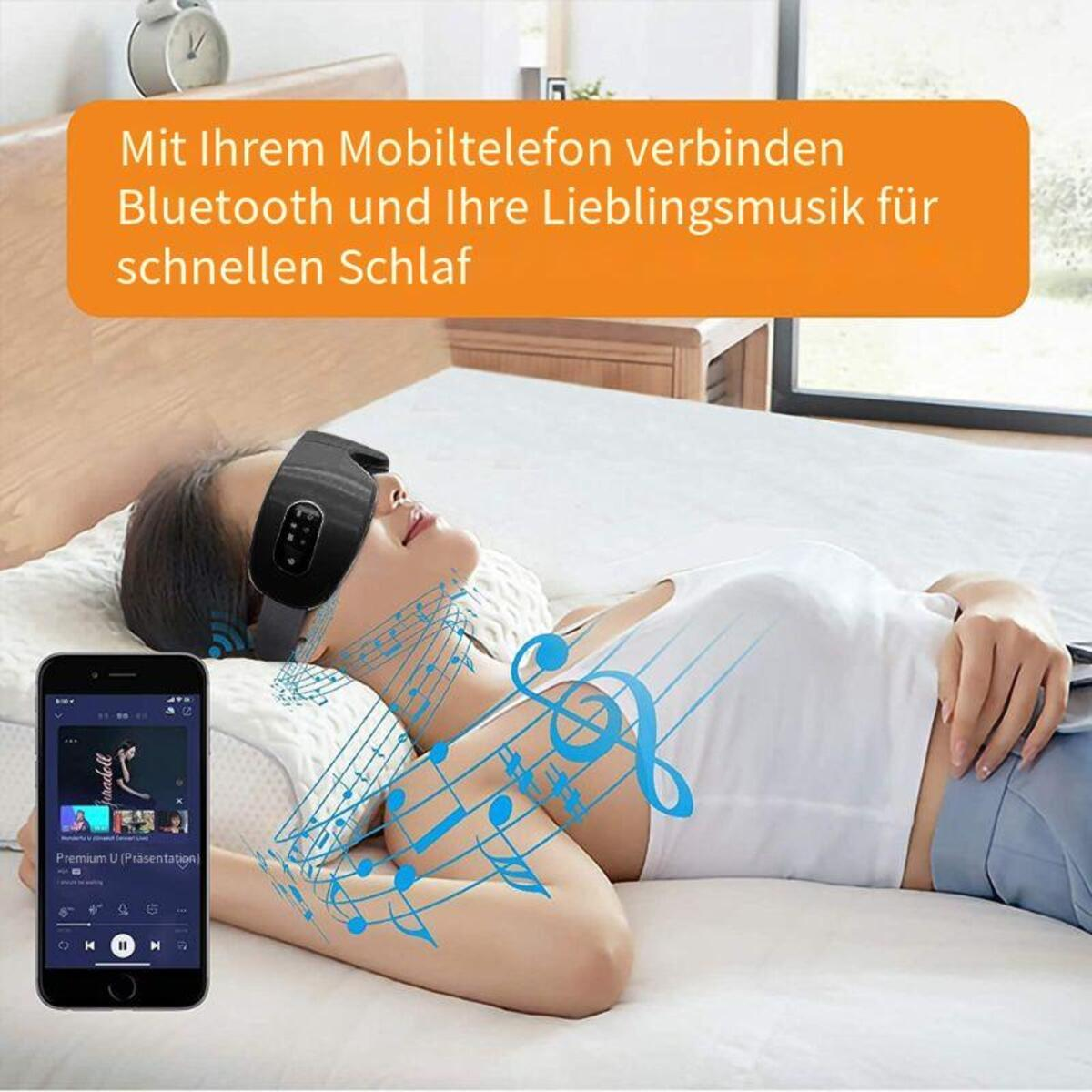 Eine Person, die eine Schlafmaske trägt, mit einem Smartphone, das Musik auf einem Bett abspielt.