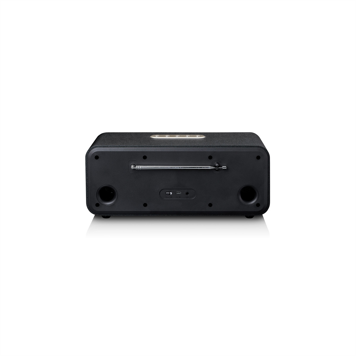 Widok z tyłu czarnego głośnika. Ma elementy sterujące na górze i dwa okrągłe głośniki z tyłu.