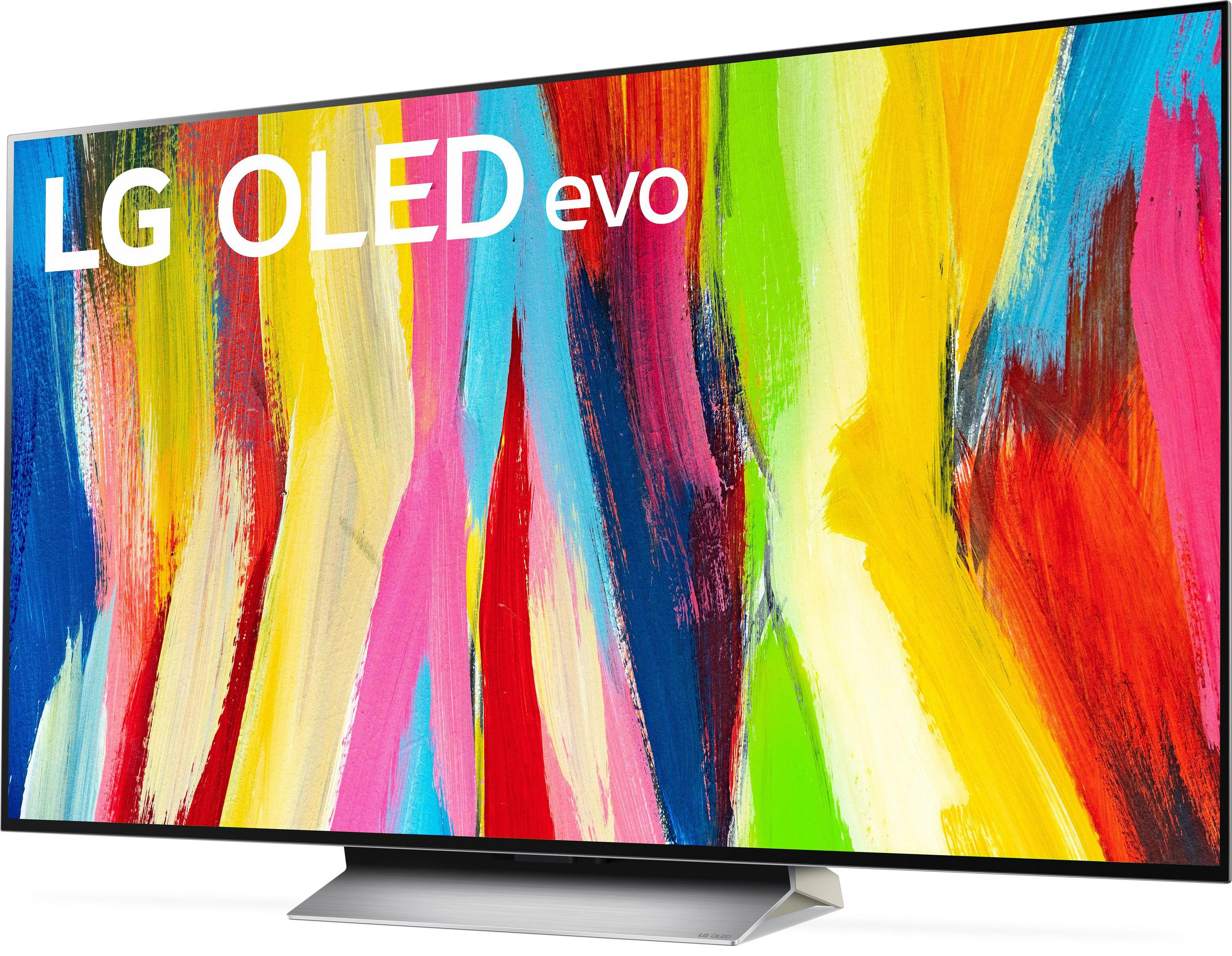 Televisor LG OLED evo grande mostrando un vibrante patrón de arte abstracto colorido.