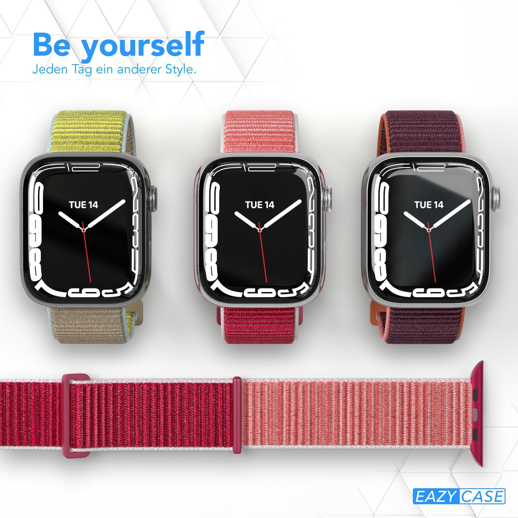 Drei Smartwatches mit Armbändern in Gelb, Rot und Dunkelrot.