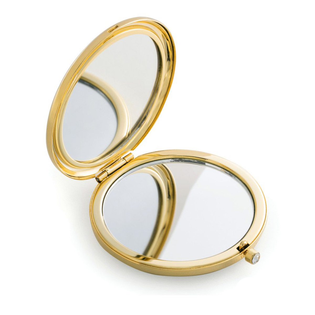 Ein offener goldener Kompaktspiegel, der die Umgebung reflektiert.