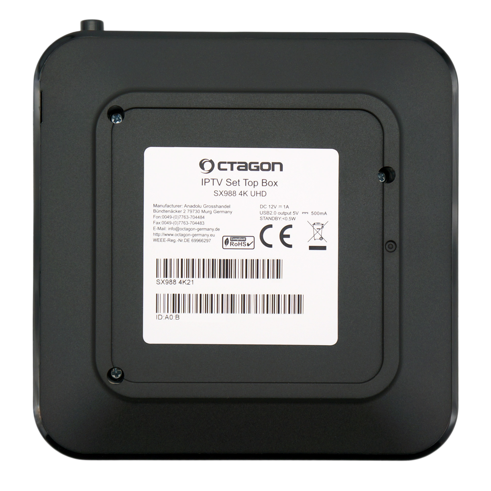 Eine schwarze Set-Top-Box, Draufsicht, mit einem Etikett mit Marke, Modell und technischen Informationen.