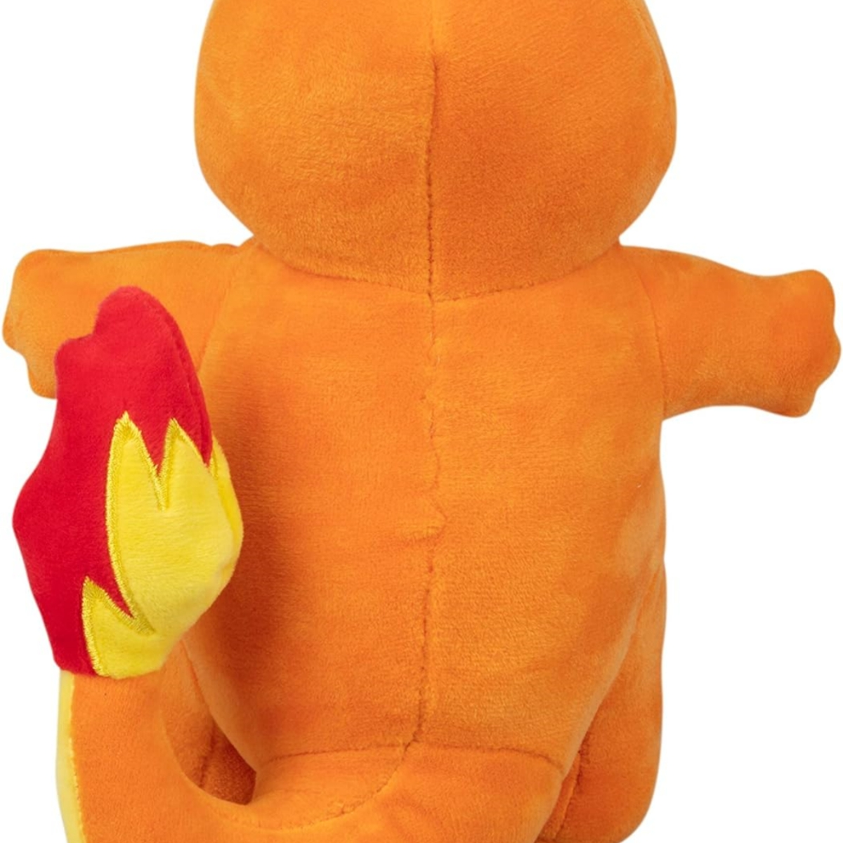 Oranges Charmander-Plüschtier mit roten und gelben Flammen auf weißem Hintergrund.