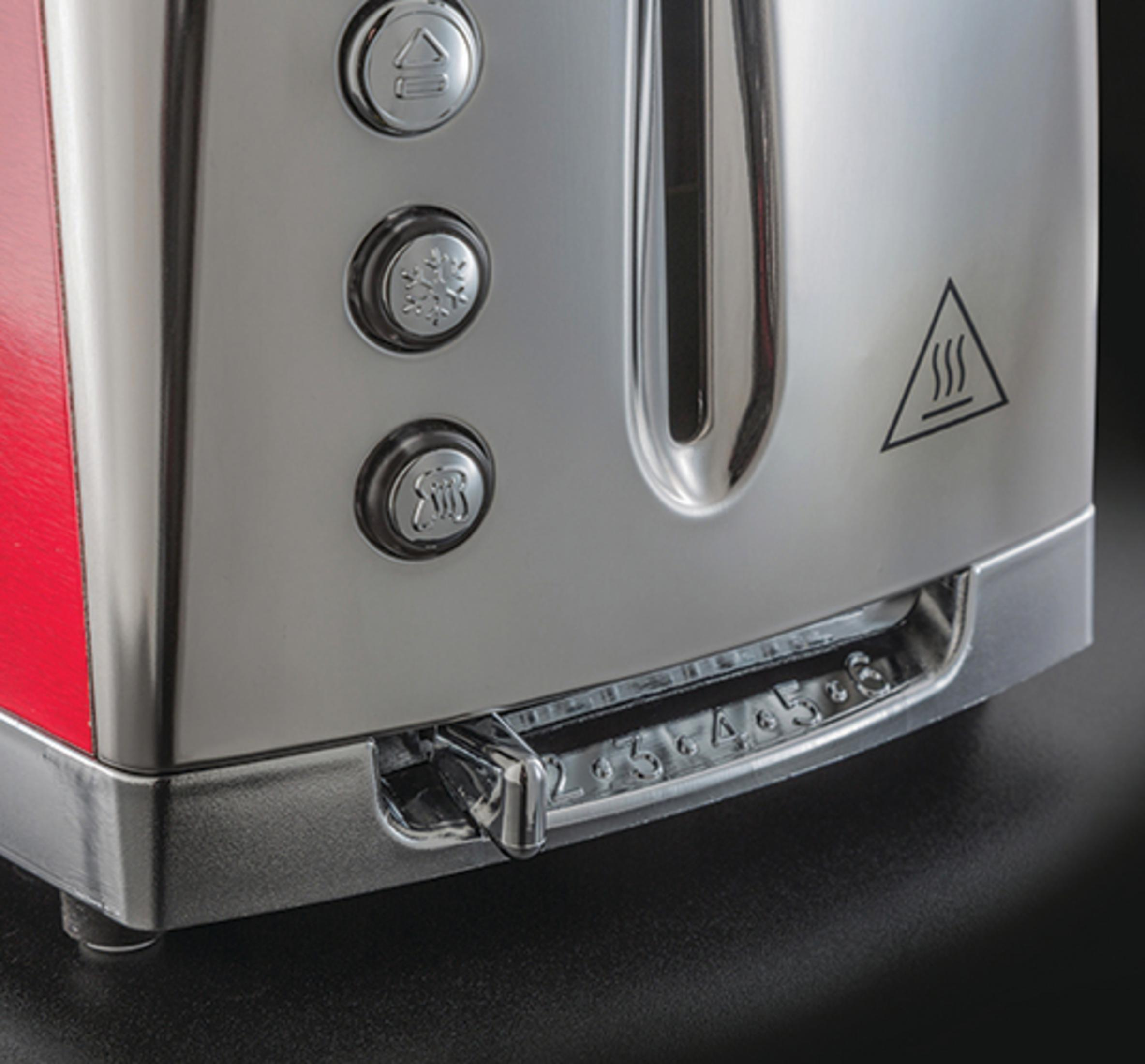 Nahaufnahme eines Toasters mit roten Seiten. Hat Knöpfe und eine Bräunungsgradanzeige.