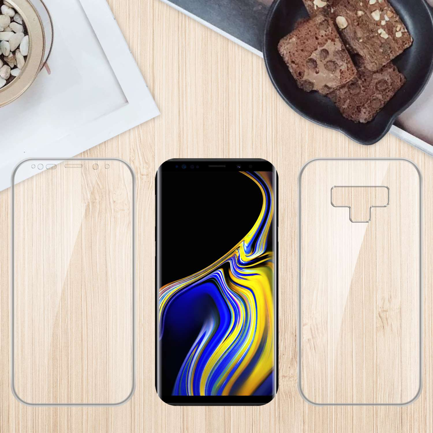 Un telefono con protezioni schermo e una superficie in legno con brownies e una piccola ciotola.