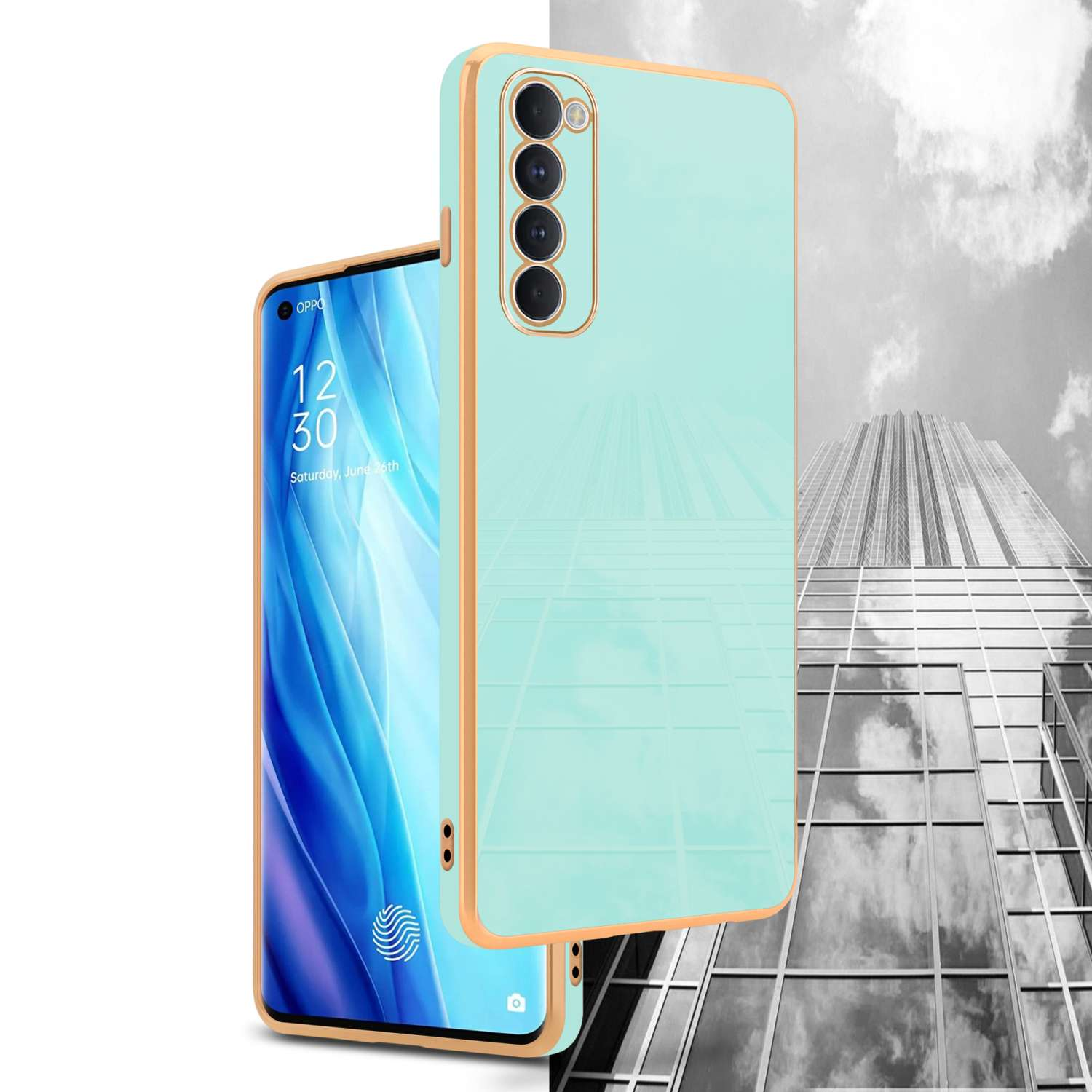 Un telefono verde menta con cornice dorata, con un edificio sullo sfondo.