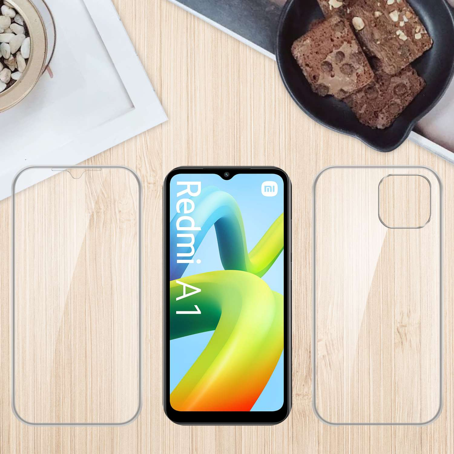 Un telefono con protezione schermo e custodia, e brownies su una superficie in legno.