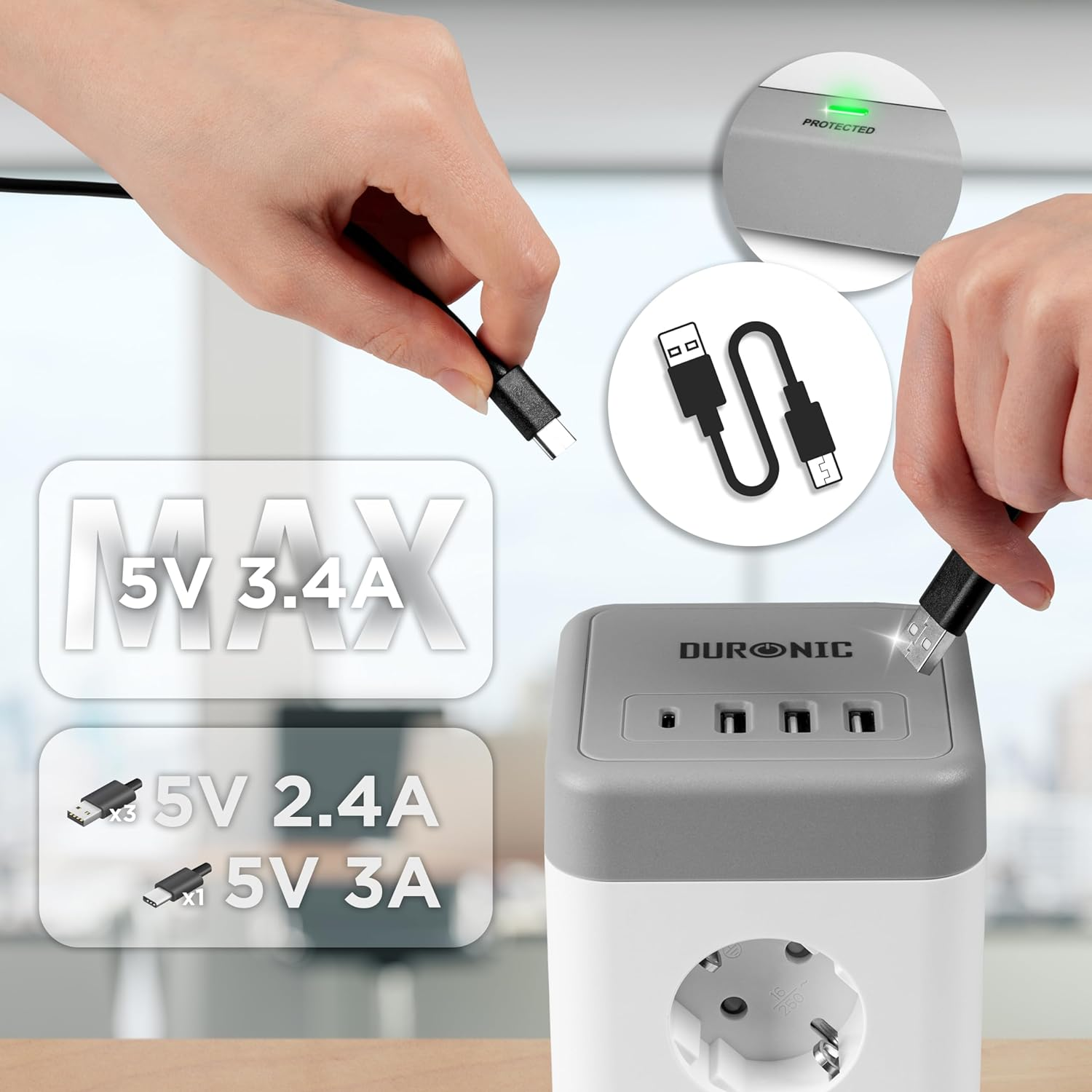Manos conectando cable USB-C a estación de carga gris y blanca. Muestra voltaje y amperaje máximos.