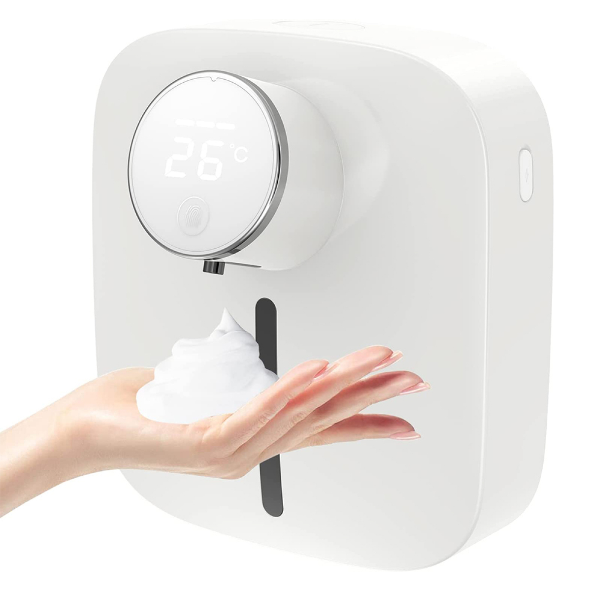 Eine Hand empfängt Schaum von einem weißen automatischen Seifenspender. Es zeigt 26 Grad Temperatur.