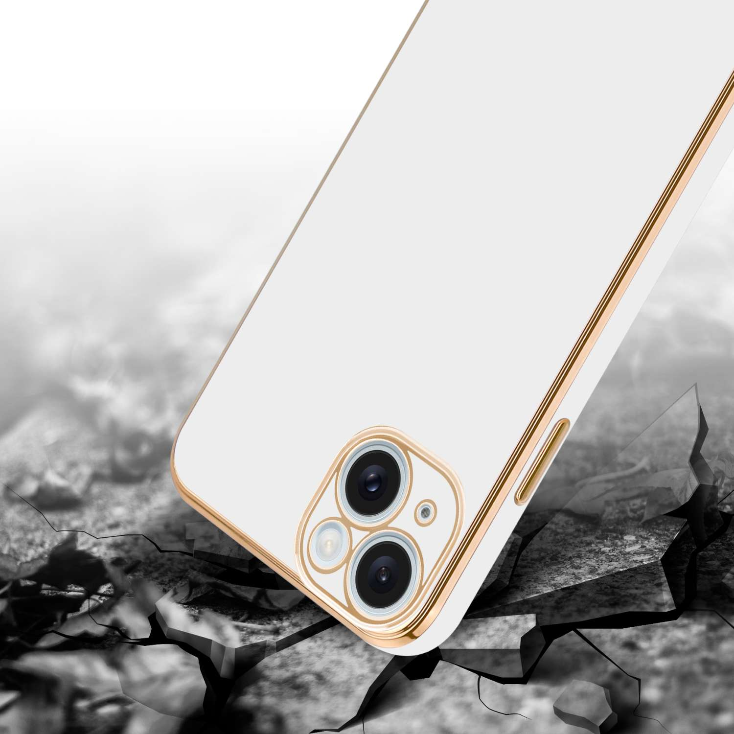 Eine Handyhülle auf einer zerbrochenen Oberfläche. Das Telefon ist weiß mit goldenem Rahmen.