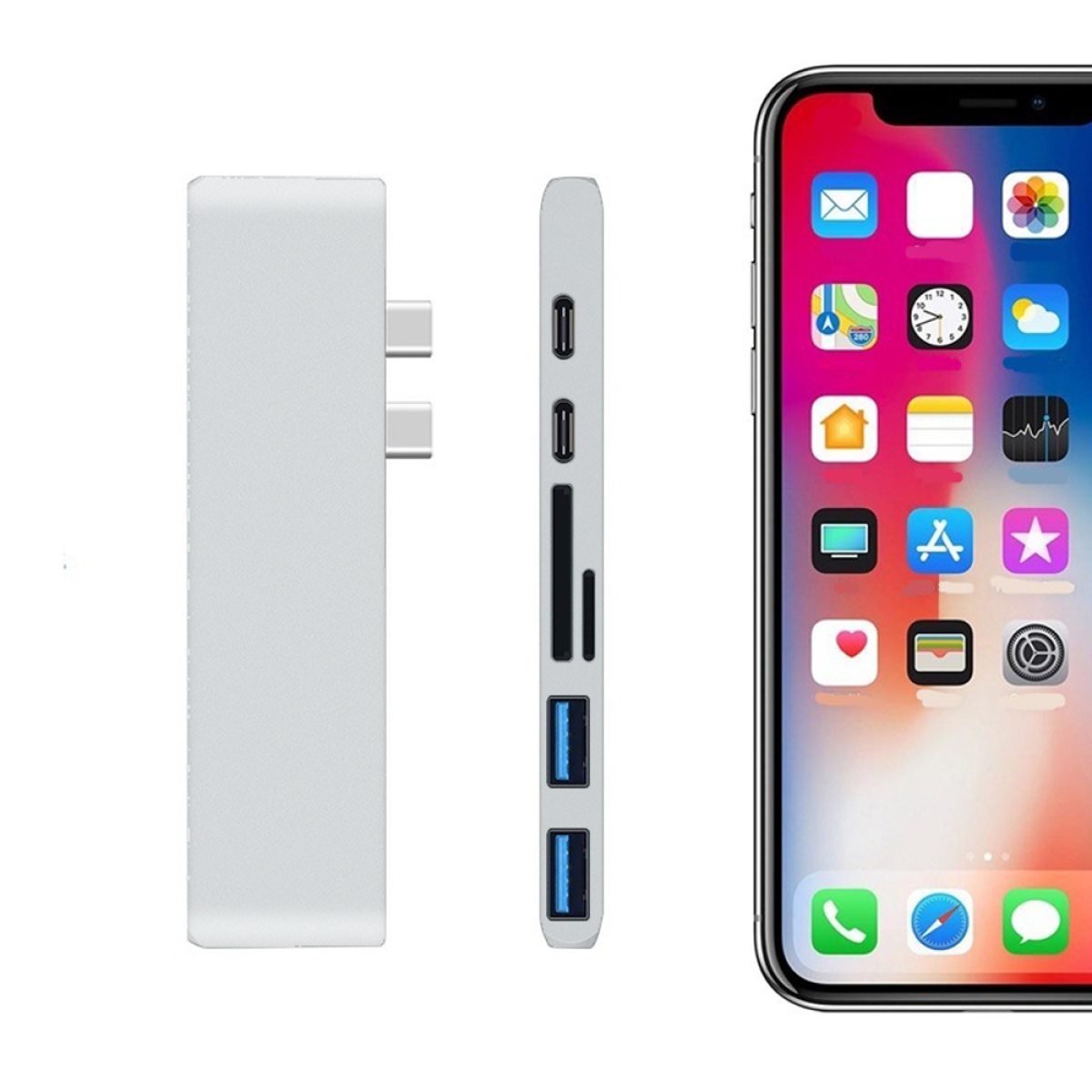 Ein silberner Hub mit USB-, SD- und USB-C-Anschlüssen neben einem Telefon, das den Startbildschirm zeigt.