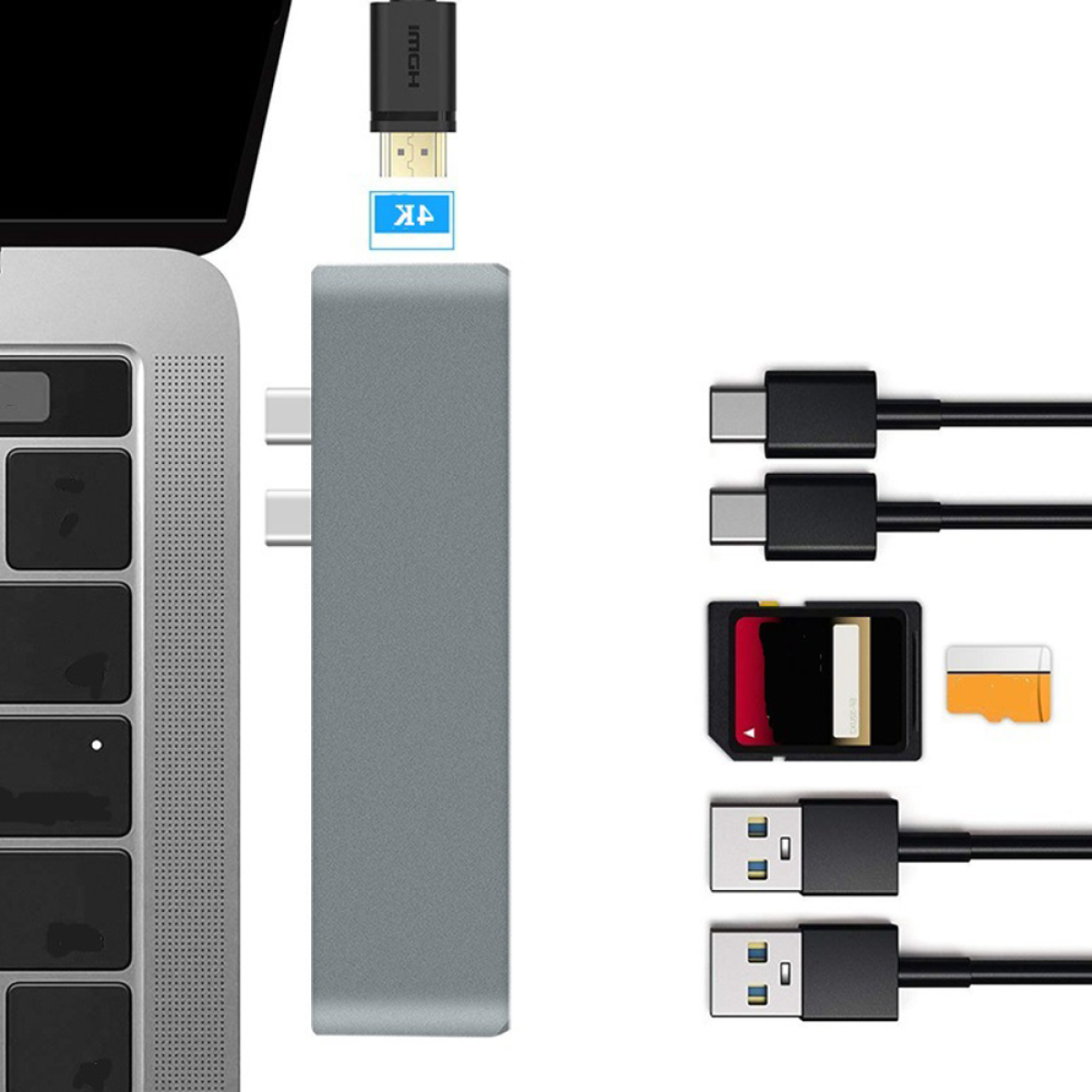 Ein grauer USB-Hub mit mehreren angeschlossenen Kabeln und Anschlüssen auf weißem Grund.