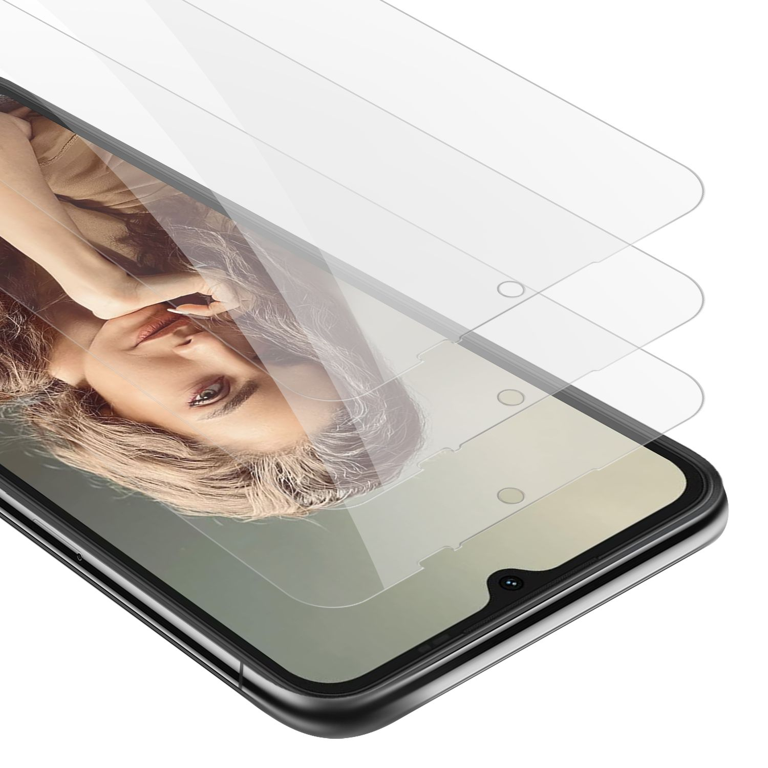 Telefono con protezioni schermo, che mostra tre protezioni sul telefono. Il volto di una donna è visibile dietro lo schermo.