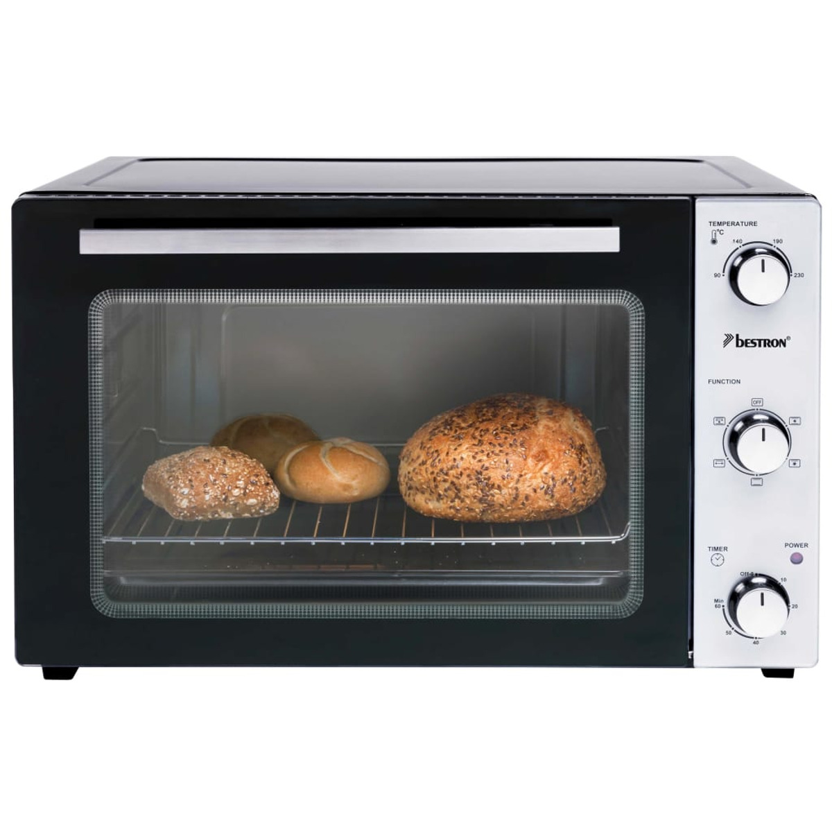 Un mini horno Bestron con tres panes dentro y diales de temperatura/función a la derecha.