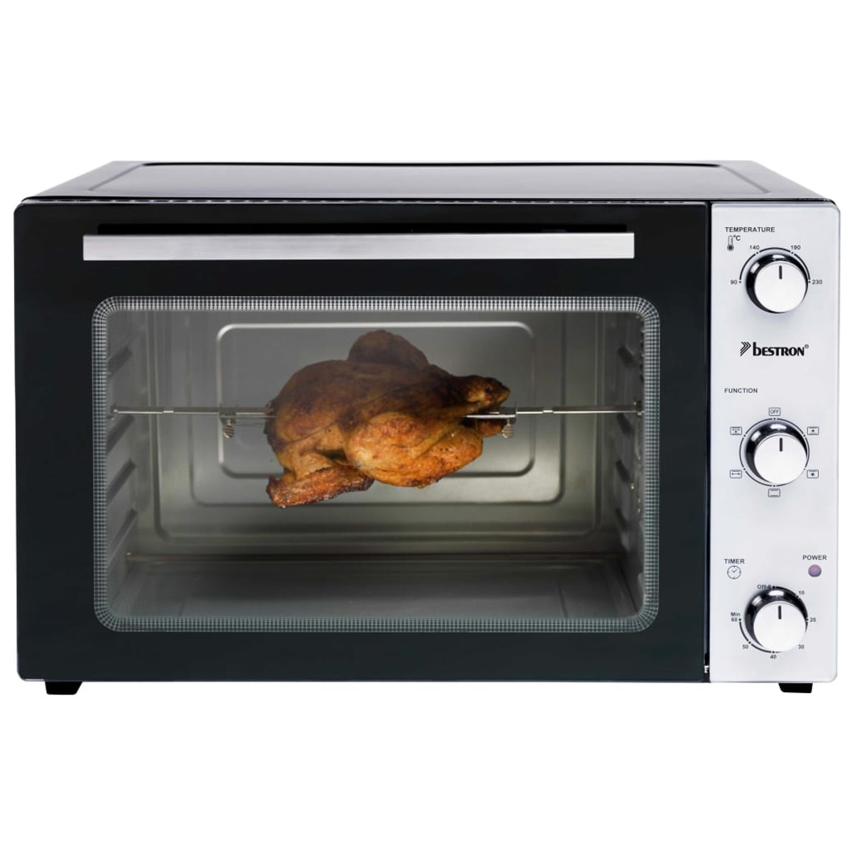Un horno con un pollo cocinado dentro.