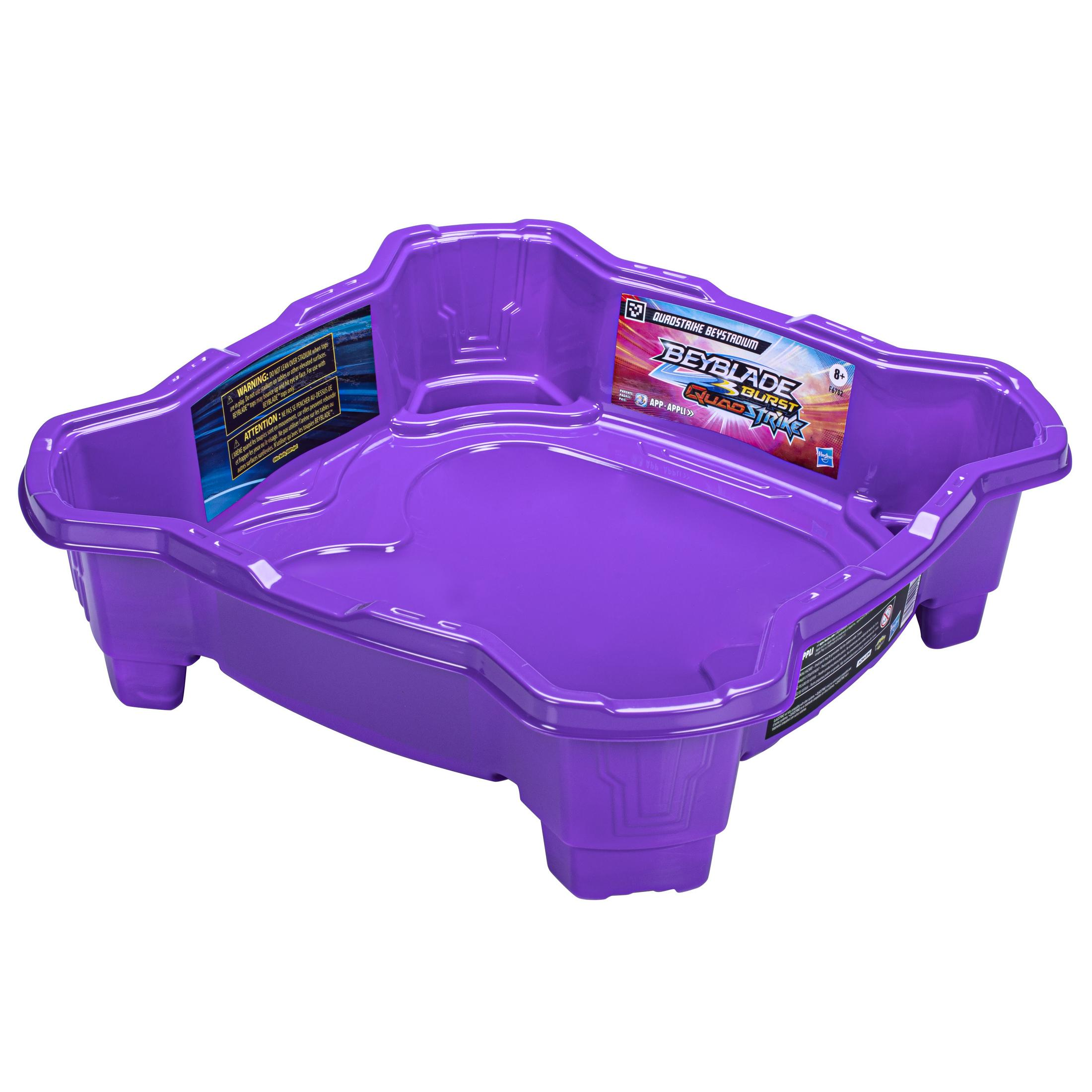 Arena de juguete morada con bordes elevados, diseñada para una batalla Beyblade.