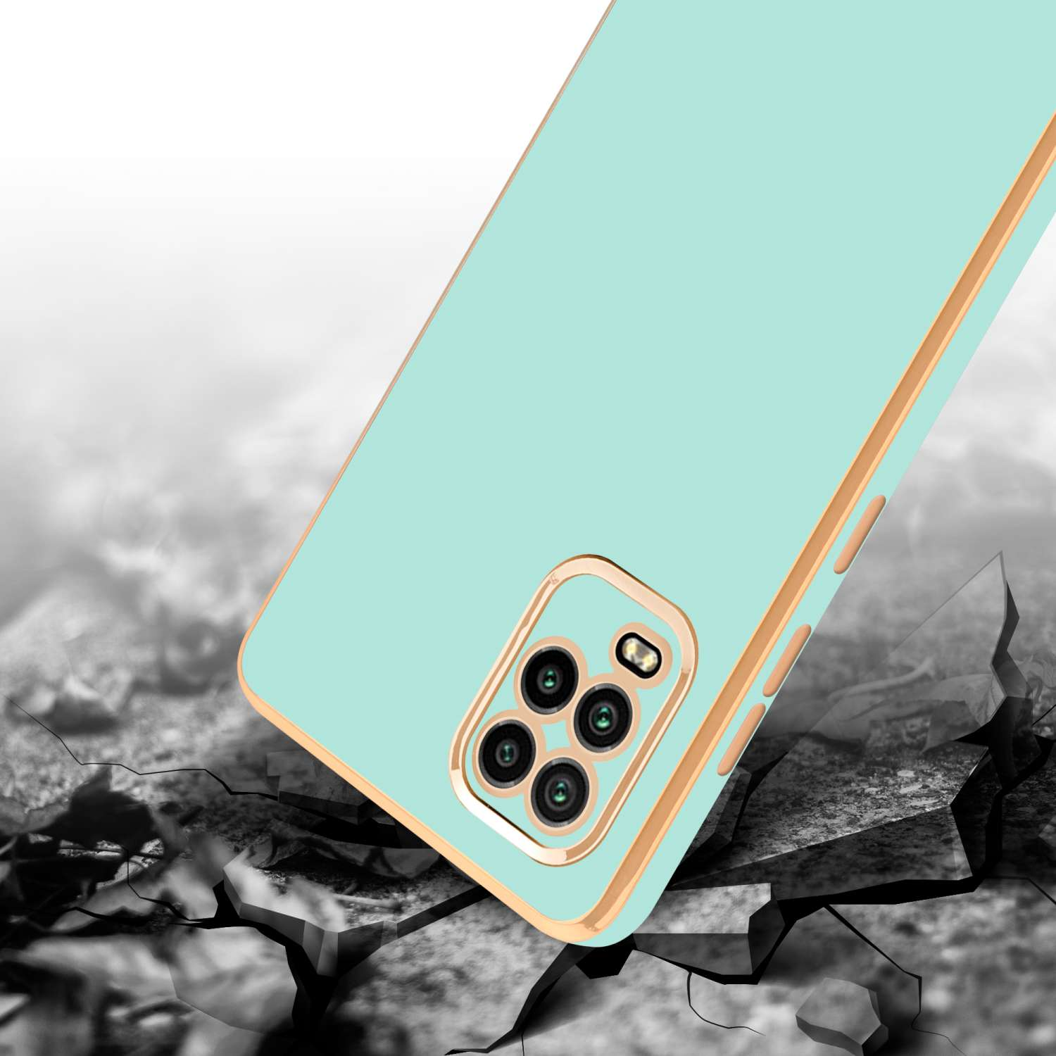 Custodia per telefono verde menta con finiture dorate, appoggiata su cemento crepato, leggermente angolata.