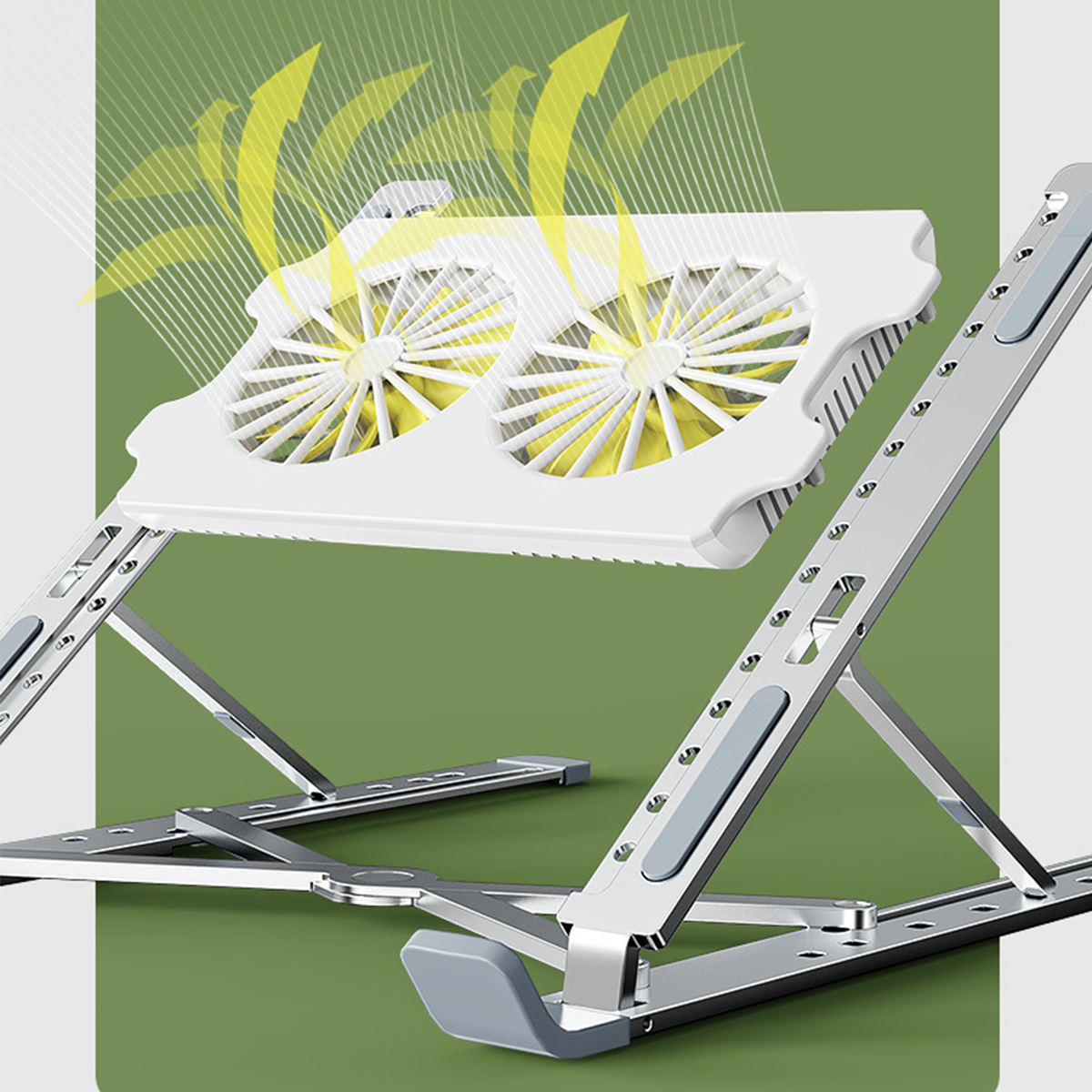 Ein weißer Laptop-Ständer mit Ventilatoren steht auf grüner Oberfläche. Die Ventilatoren sind gelb.